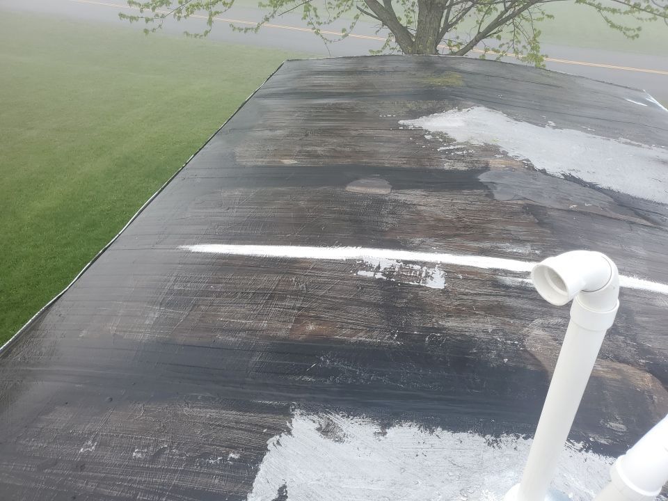 Residential Roofing Installation using 60 mil rubber roof  by Nitro Roofing and Construction