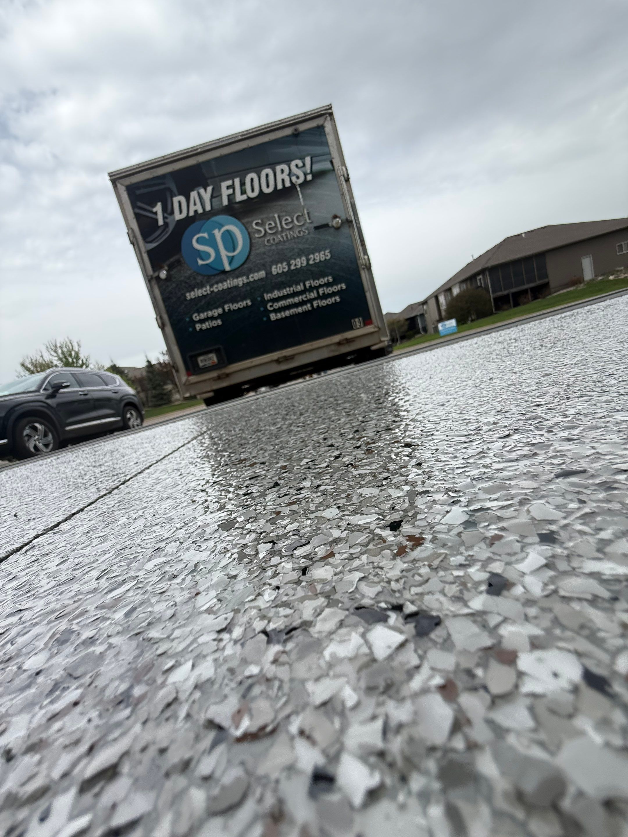 High-Gloss Epoxy Garage Floor Coating in Sioux Falls by Select Painting, Coatings & Garage Cabinets