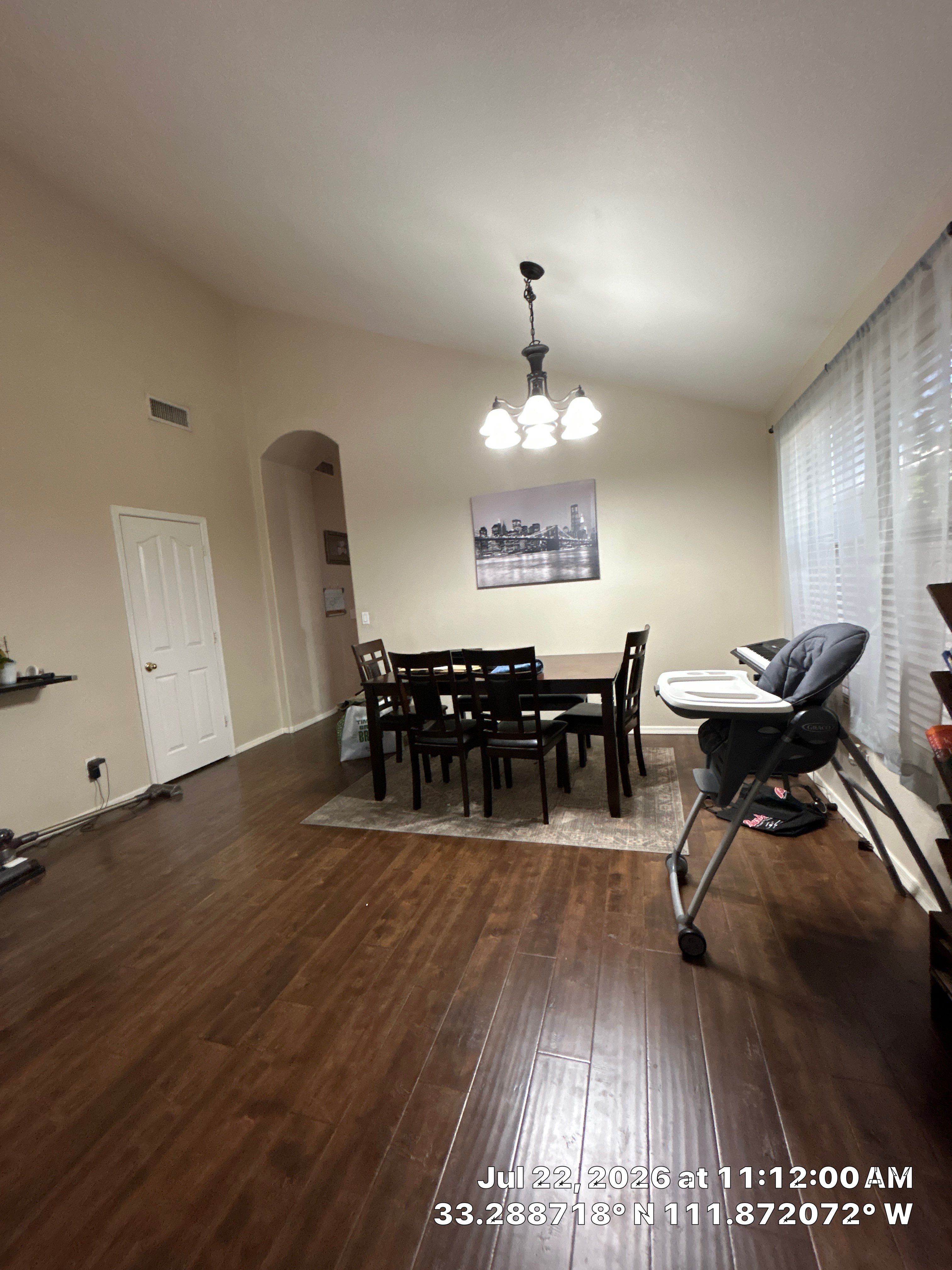 Chandler Dining Room Floor Remodel with Dark Wood-Look Laminate by CompanyCam Sales Demo