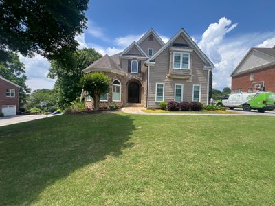 Full Exterior Siding Replacement and Stone Veneer Installation in Roswell