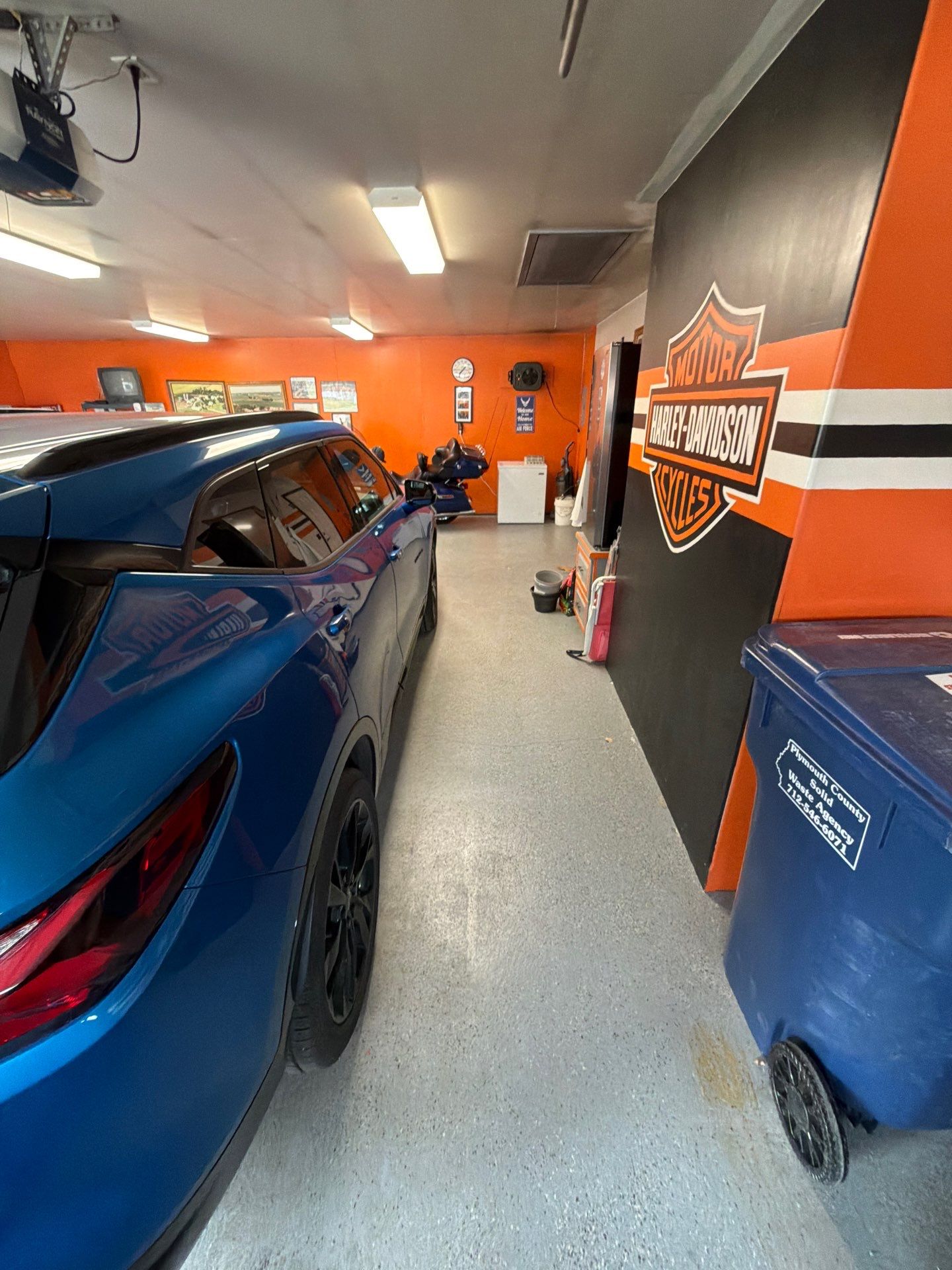Custom Grey Flake Epoxy Garage Floor Installation in Remsen by Select Painting, Coatings & Garage Cabinets
