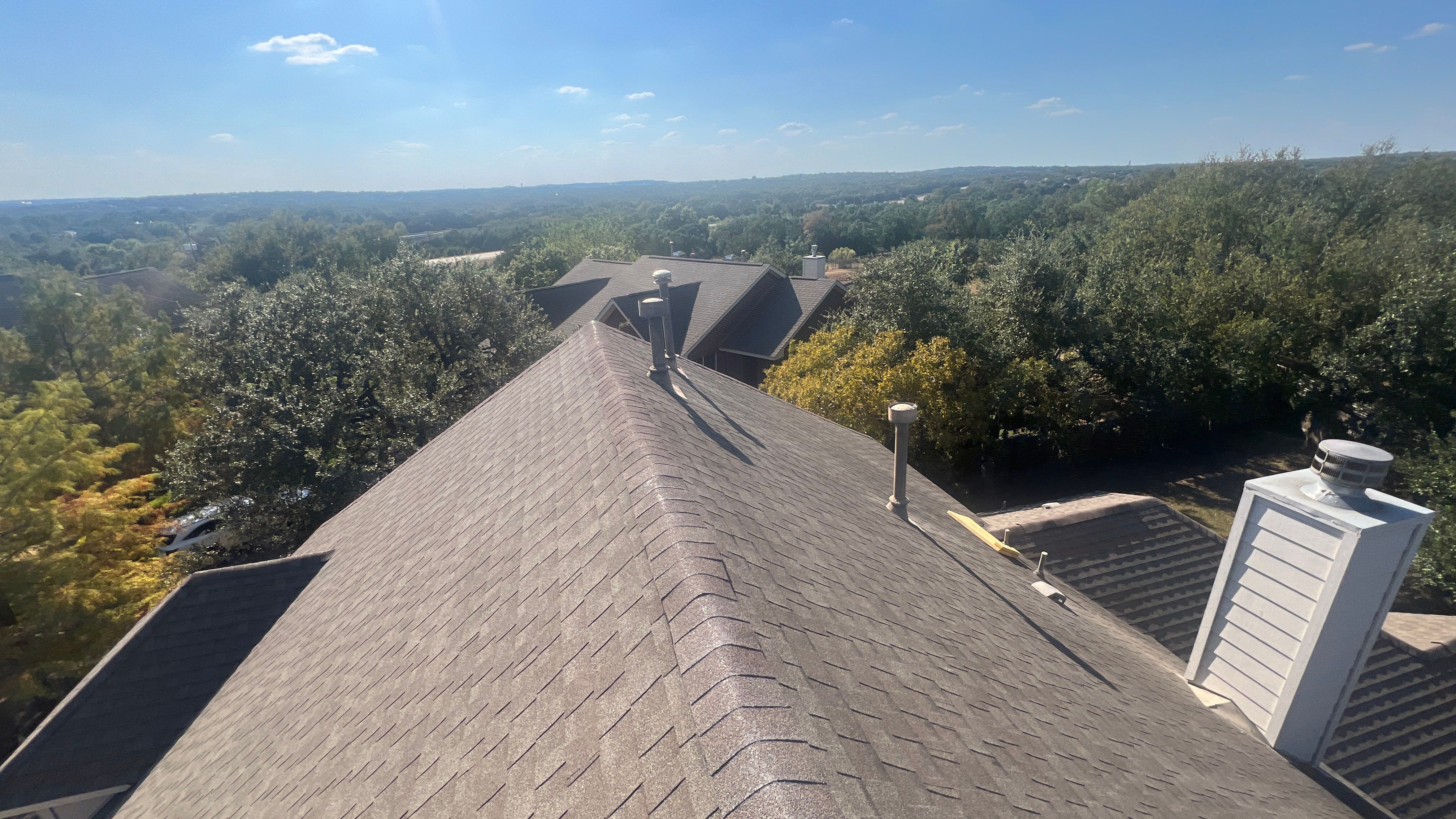 Asphalt Shingle Roof Replacement and Storm Damage Restoration in Austin by Caliber Restoration LLC