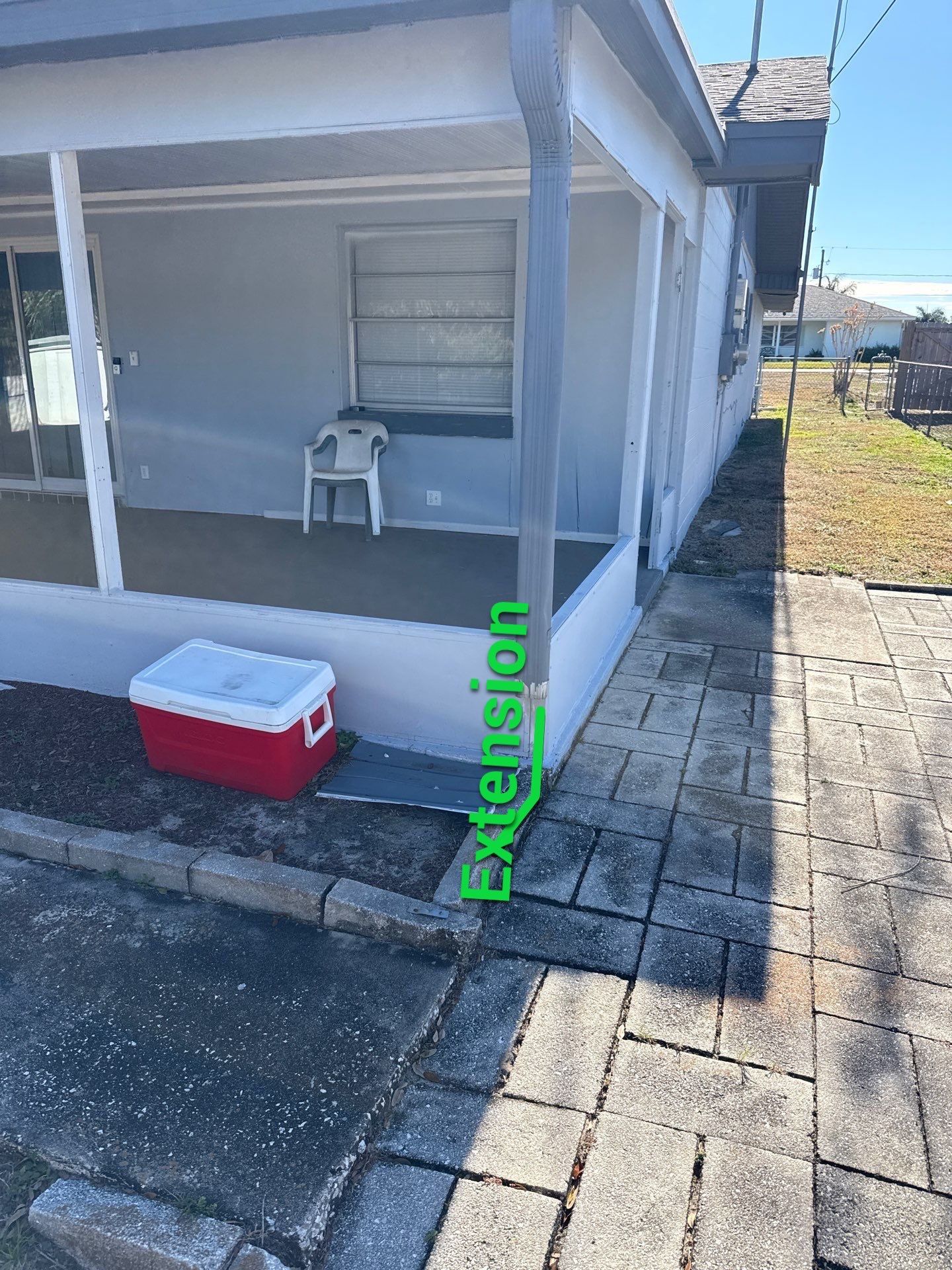 Downspout Installation using Downspout Extension and new Gutters in Winter Haven FL by Gutter Professors