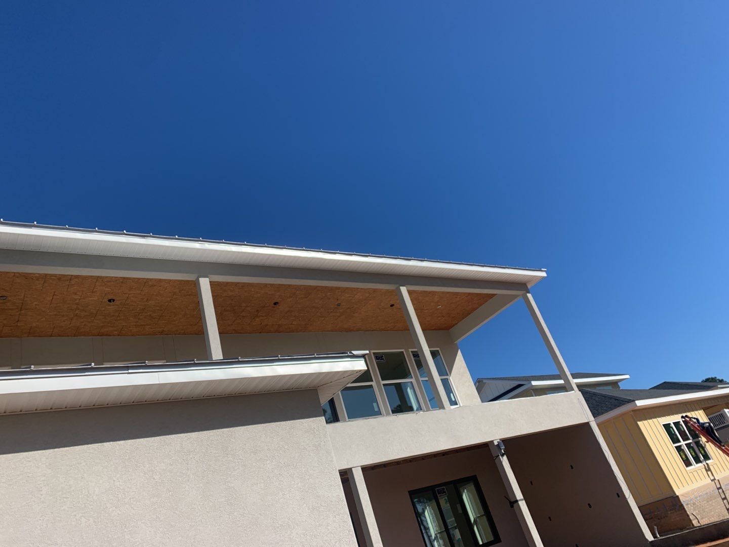 Soffit and Fascia Installation using White Vinyl Soffit in Pensacola FL by Gutter Professors