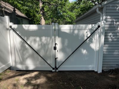 White Vinyl Privacy Fence and Double Gate Installation in Cedar Falls