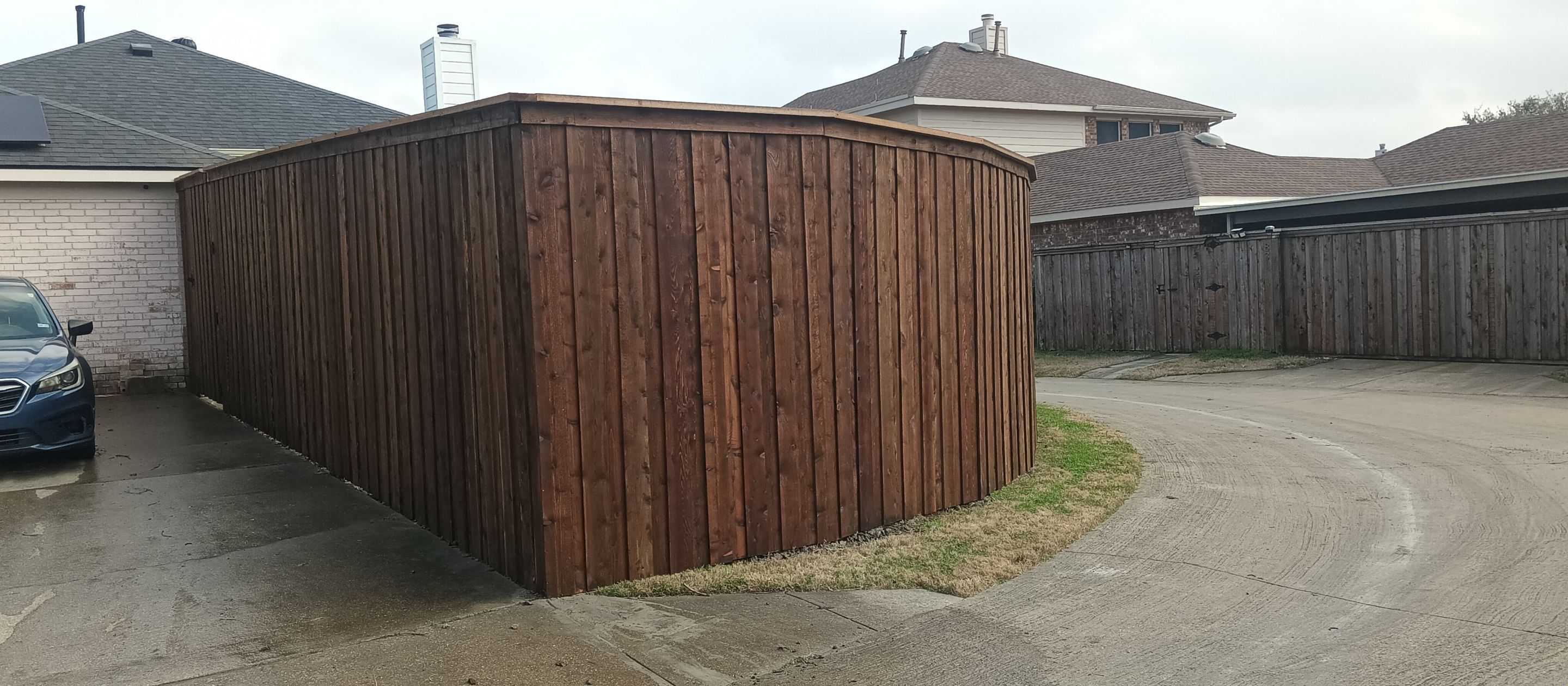 Pre-Stained 8' Board on Board cedar w/ trim and cap  by Grizzly Fence And Patio