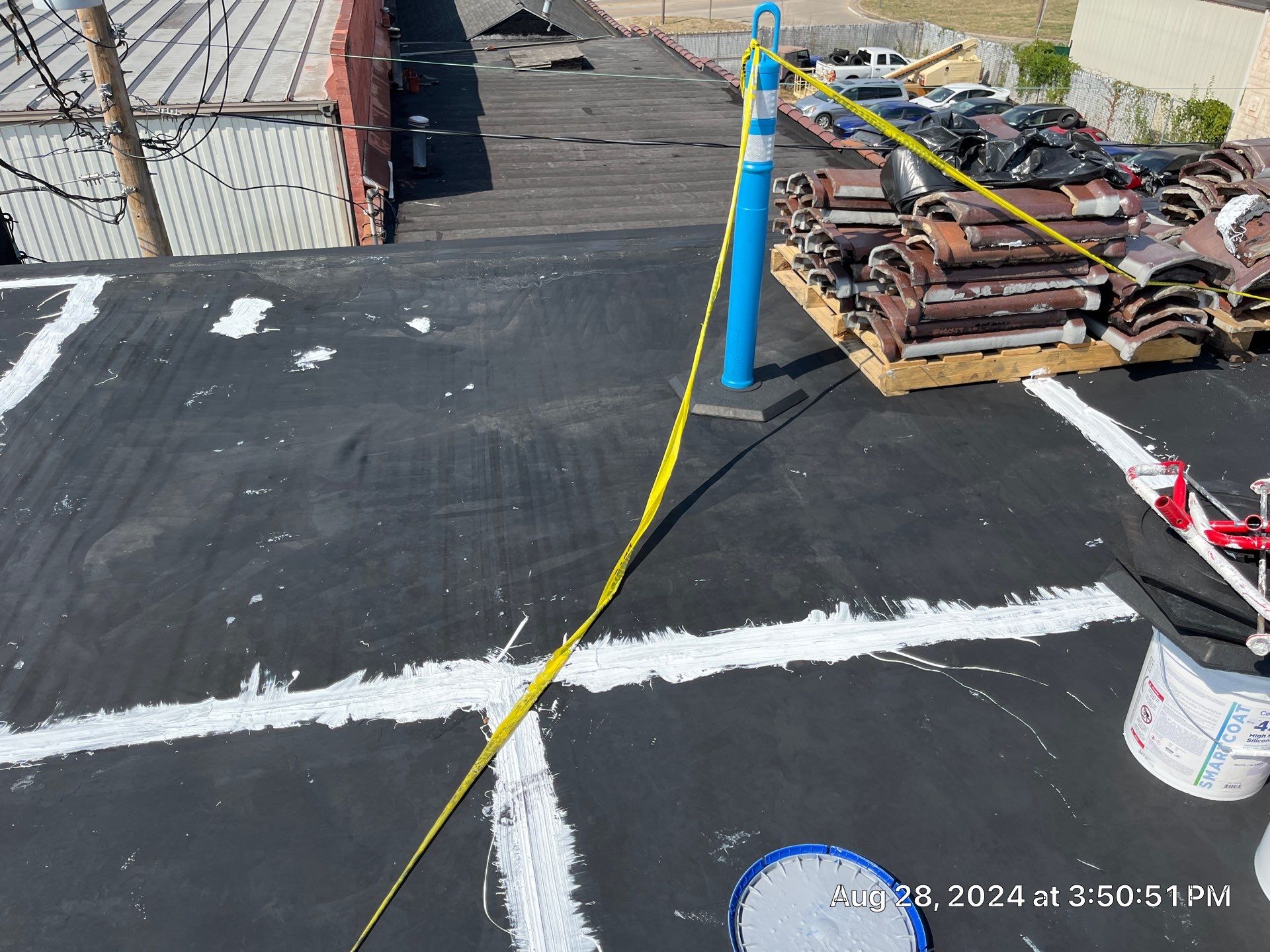 Commercial Roofing Installation using smartcoat Roof coating by Fahey Roofing + Contracting