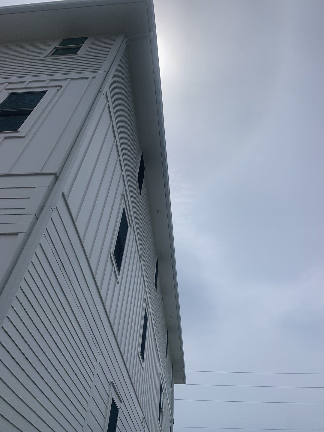 Downspout Installation for Multi-Story Building in Panama City FL by Gutter Professors