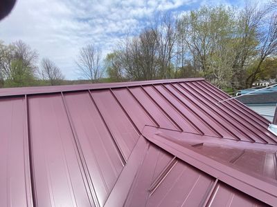 Residential Roofing Installation using 16" Standing Seam Panels