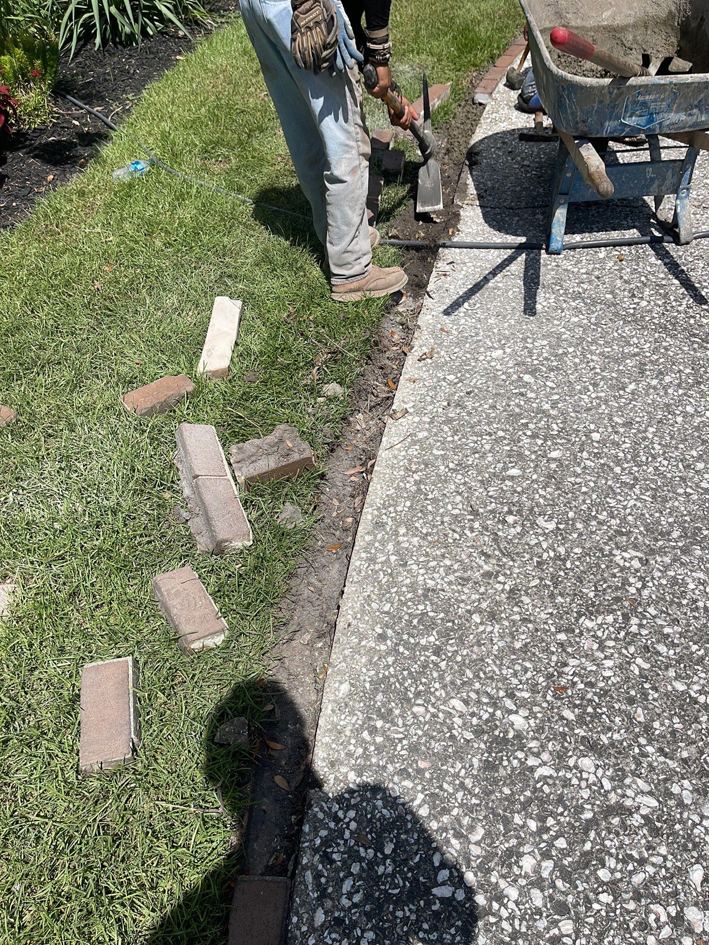 Custom Exposed Aggregate Driveway with Red Brick Borders in Hilton Head Island by Lowcountry Scapes, LLC