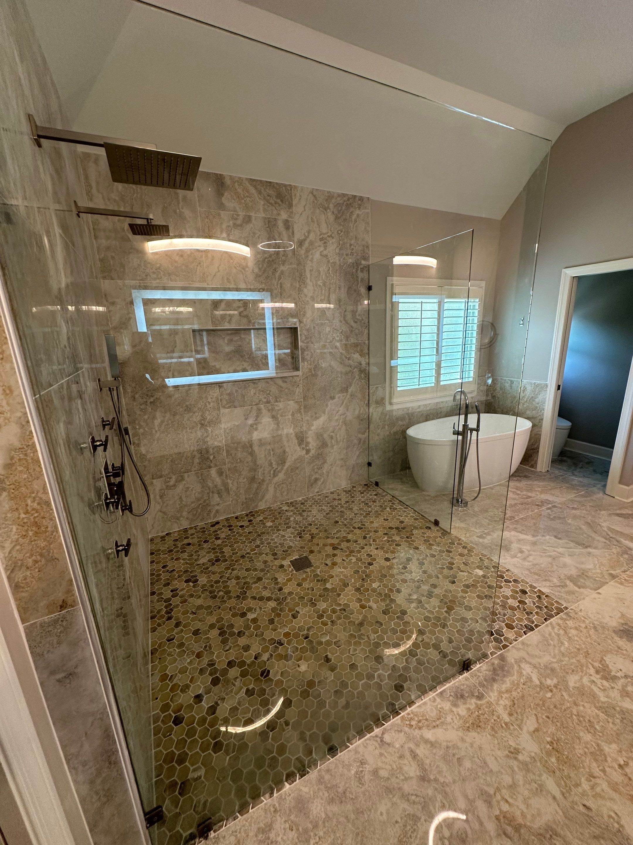 Finished Tiled Bathrooms by Next Step Contracting