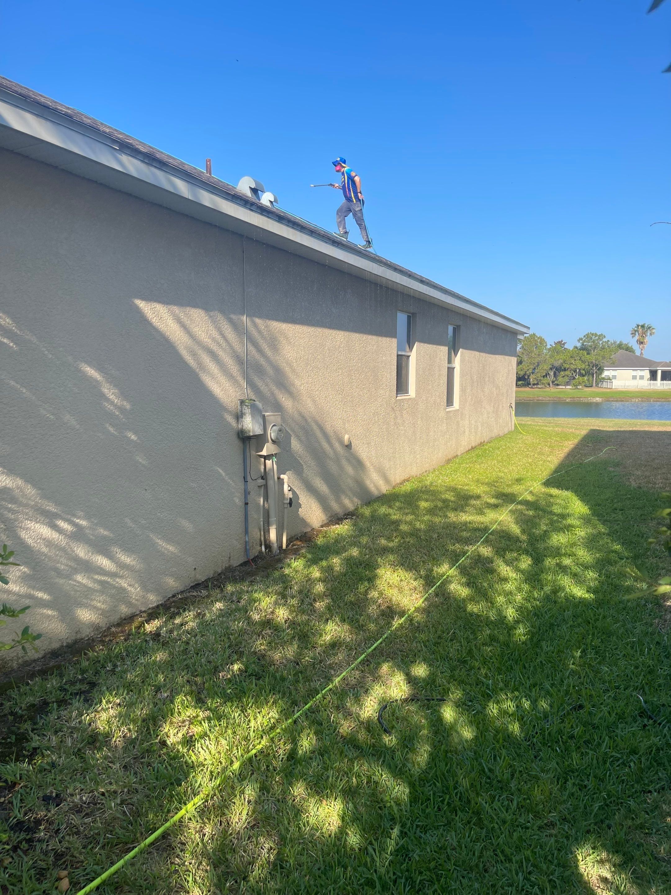 Asphalt Shingle Roof Soft Wash Cleaning & Concrete Pressure Washing in CopperStone Community, Parrish, FL by Sunshine AquaWash