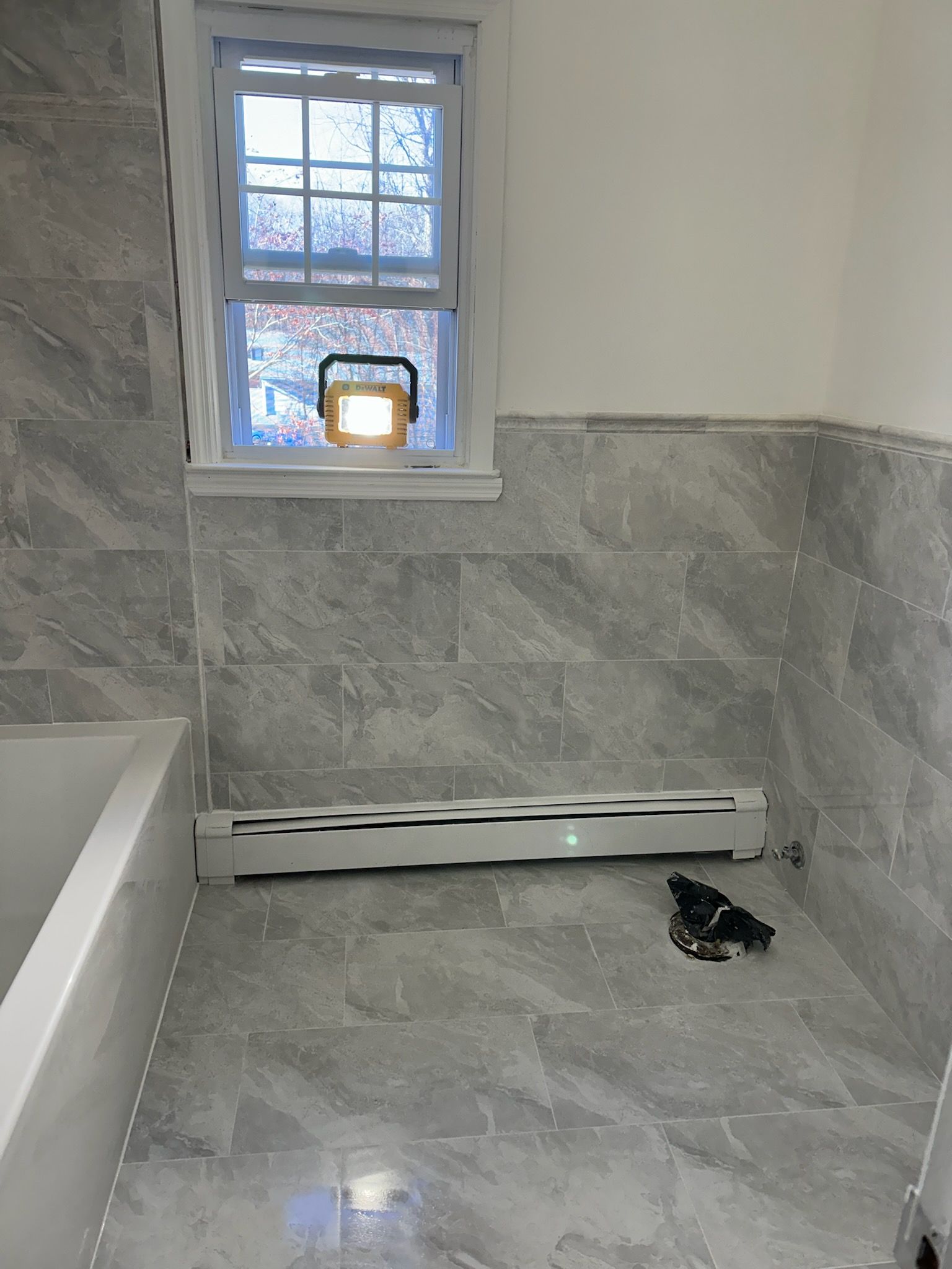 Bathroom Remodel using Porceline Tile from The Tile Shop by Footprints Floors Morristown