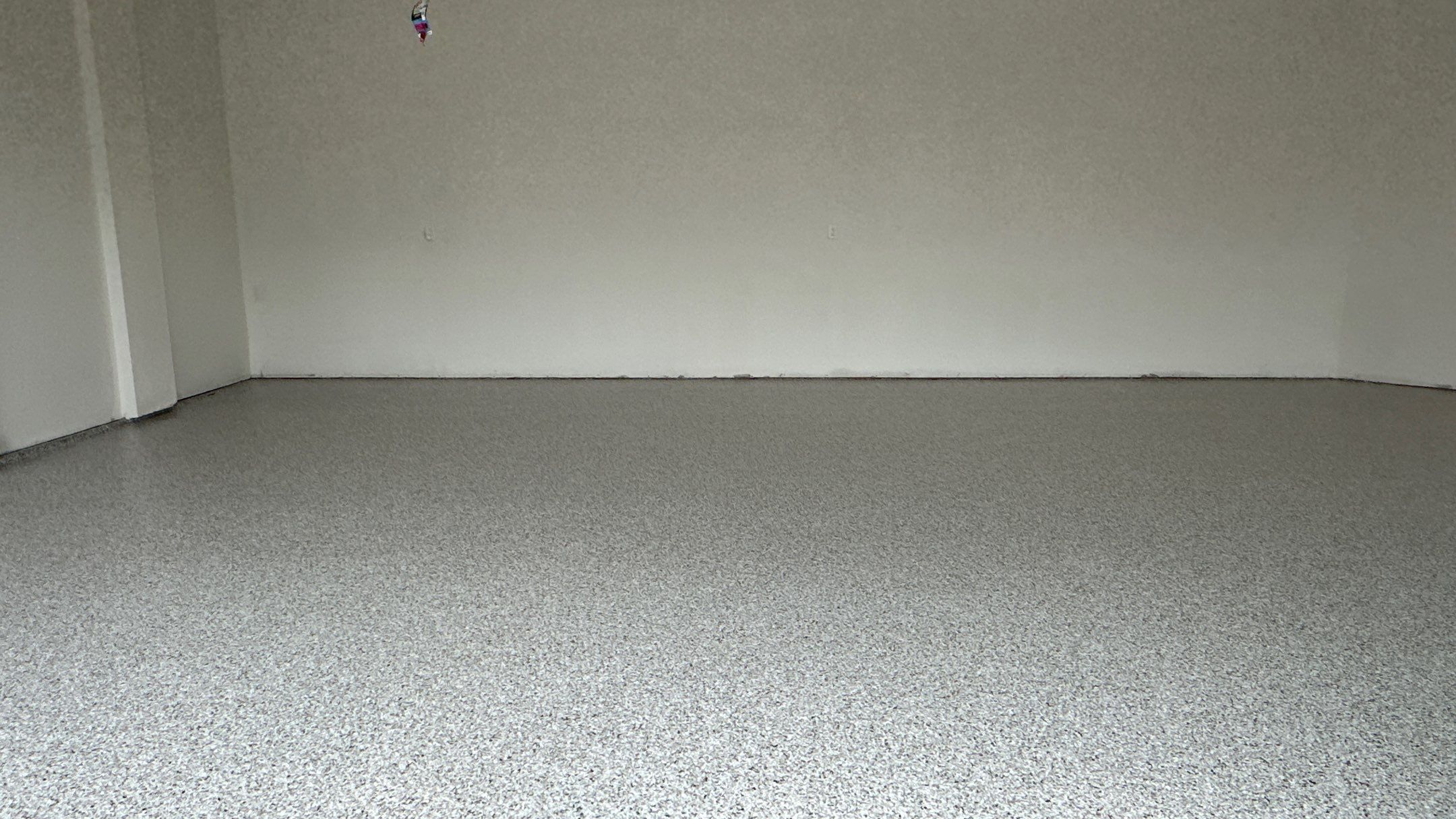 Jon S. transformed his garage with a new floor, slotwall & Cabinets! by Banner Garage
