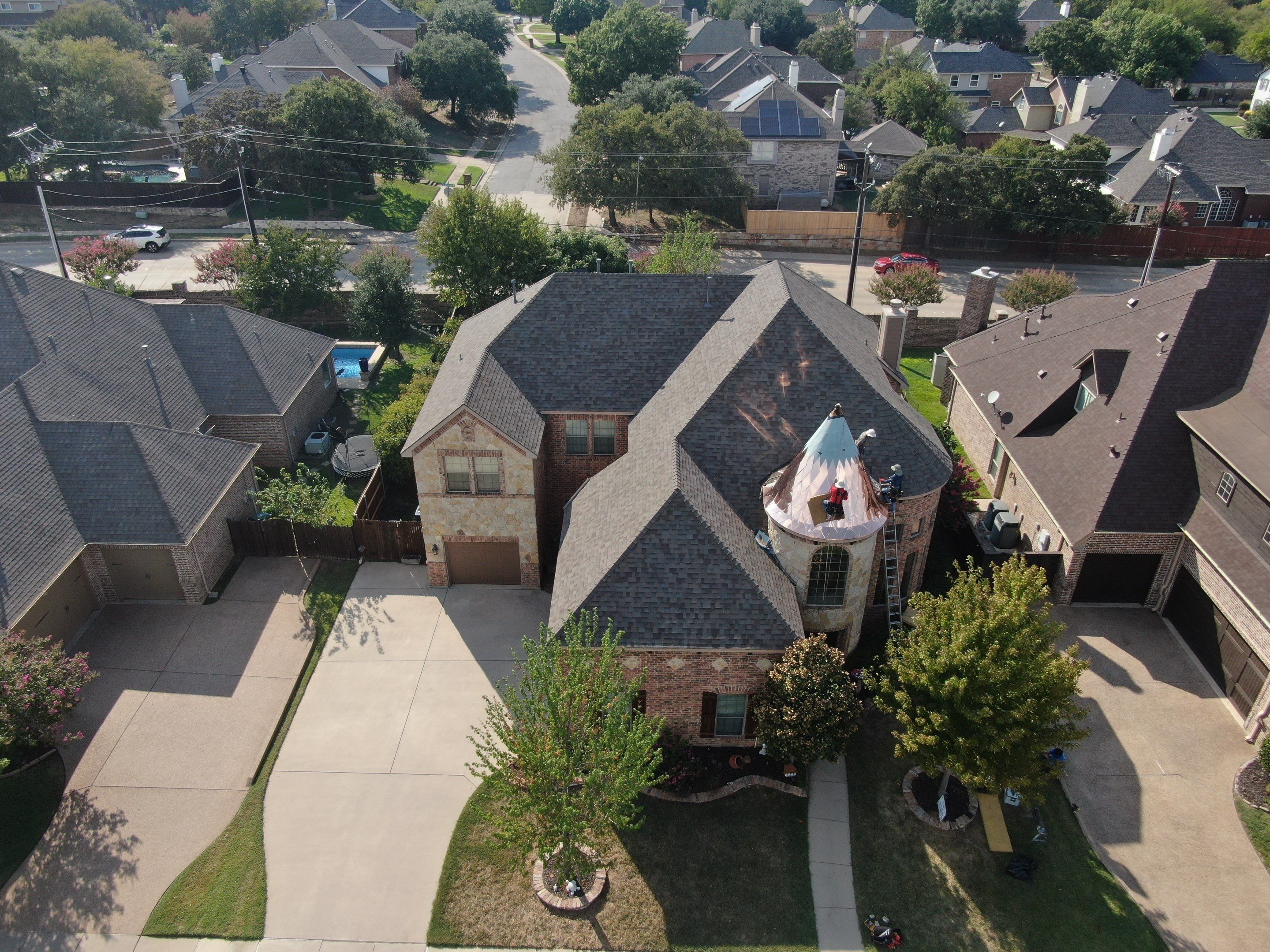 Installing Custom copper turret and Malarkey Vista Class 4 shingles Hail Damage Upgrade by Becker Roofing and Exteriors