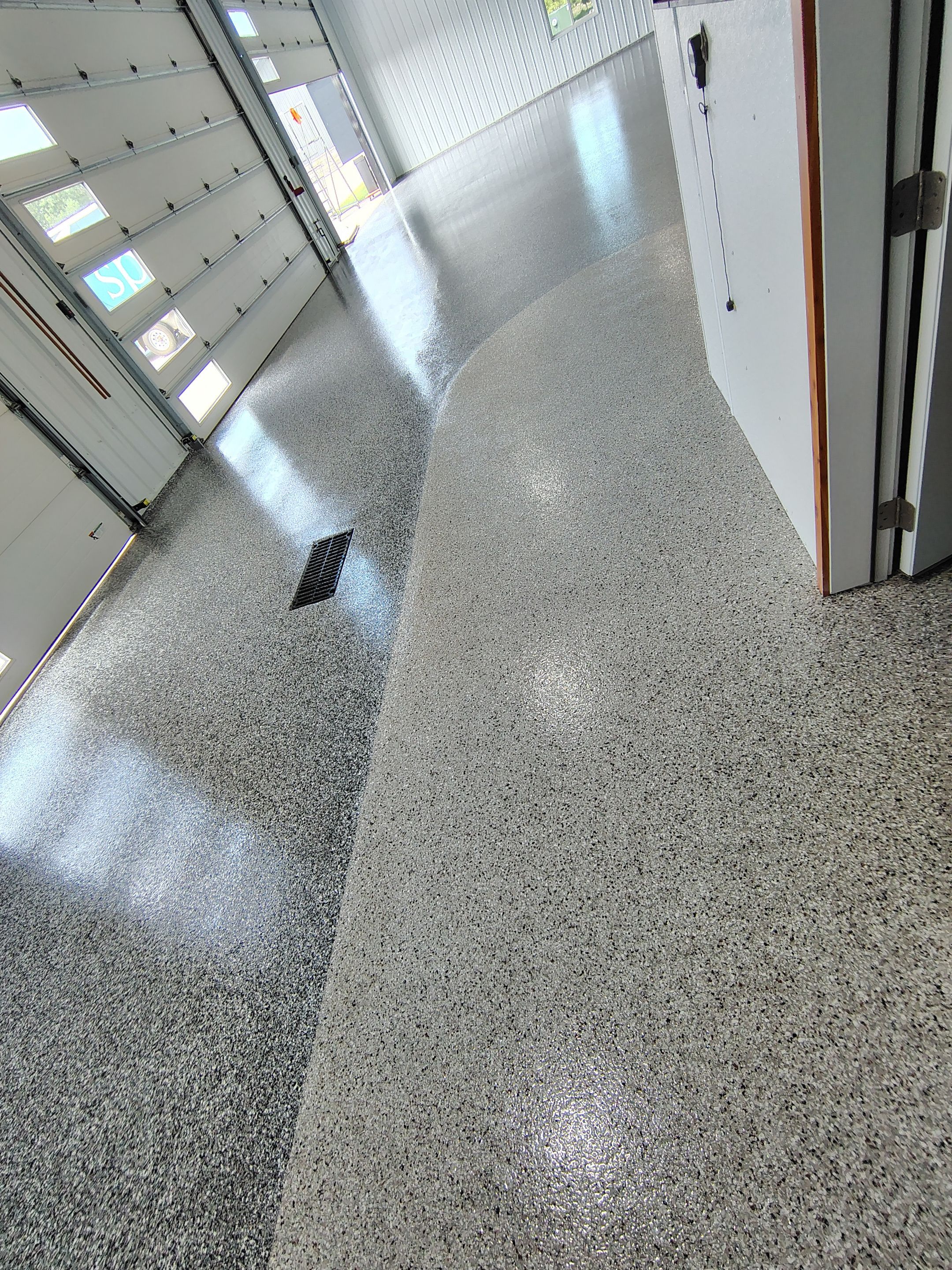 Multi-Stage Concrete Floor Coating for Egan Shop and RV Storage by Select Painting, Coatings & Garage Cabinets