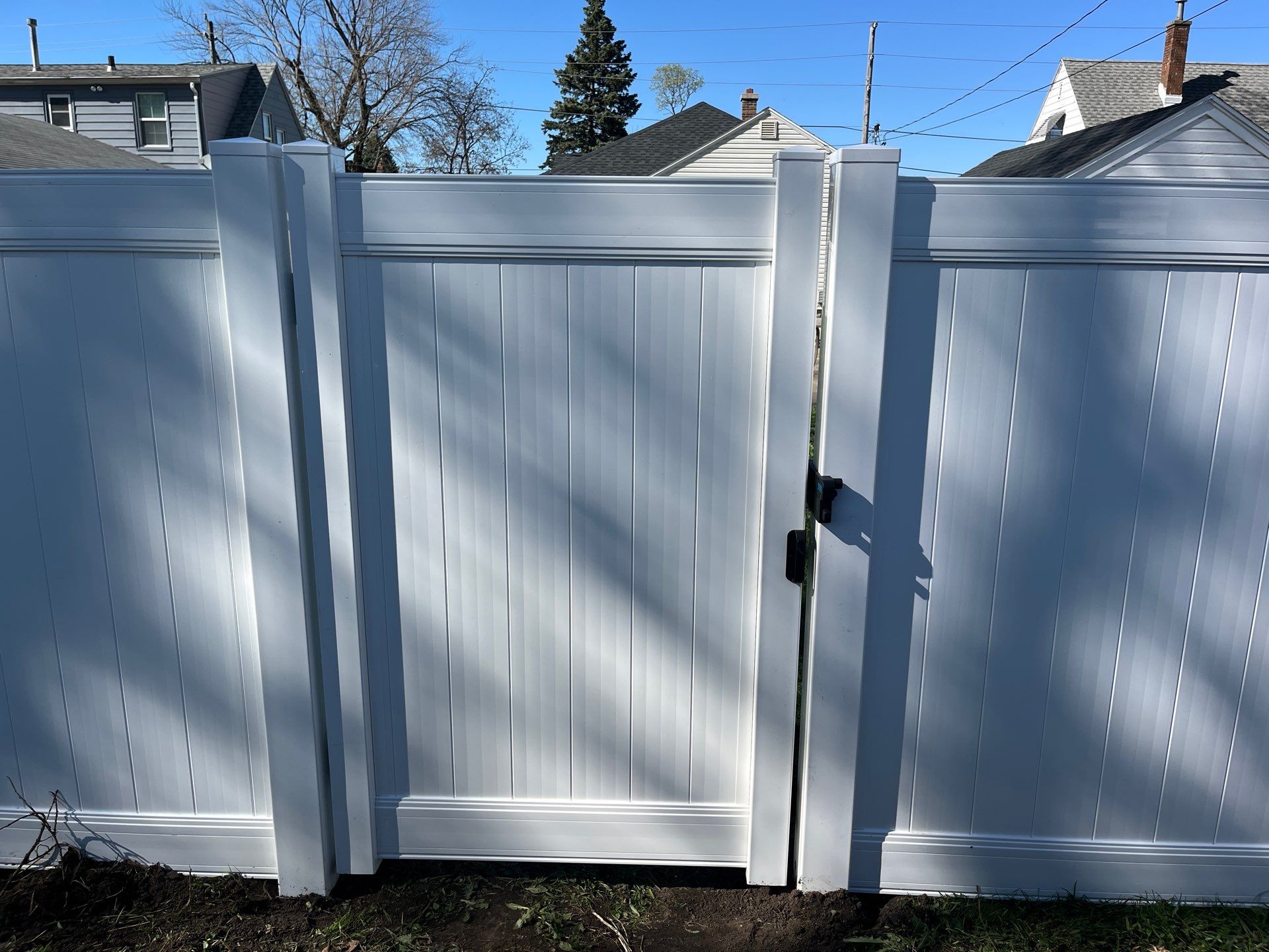Residential White Vinyl Privacy Fence Installation in Waterloo, Iowa by Perfect Picket Fence and Stain