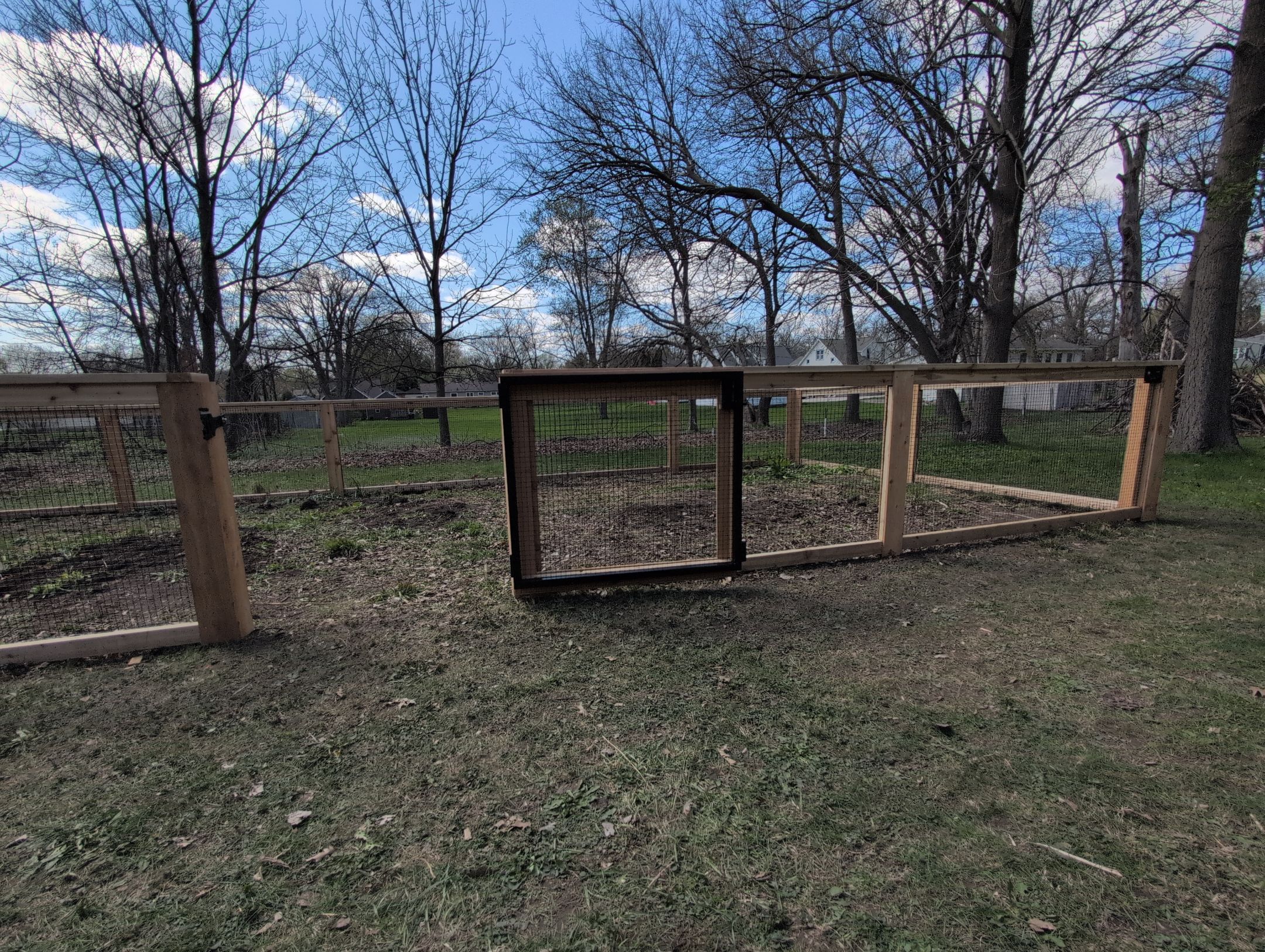 Custom Cedar Wood Garden Fence Installation in Cedar Falls by Perfect Picket Fence and Stain
