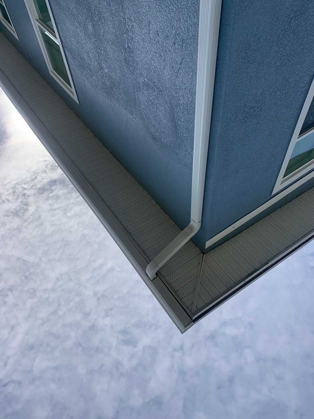 Downspout Installation for Two-Story Home in Fort Myers FL by Gutter Professor by Gutter Professors