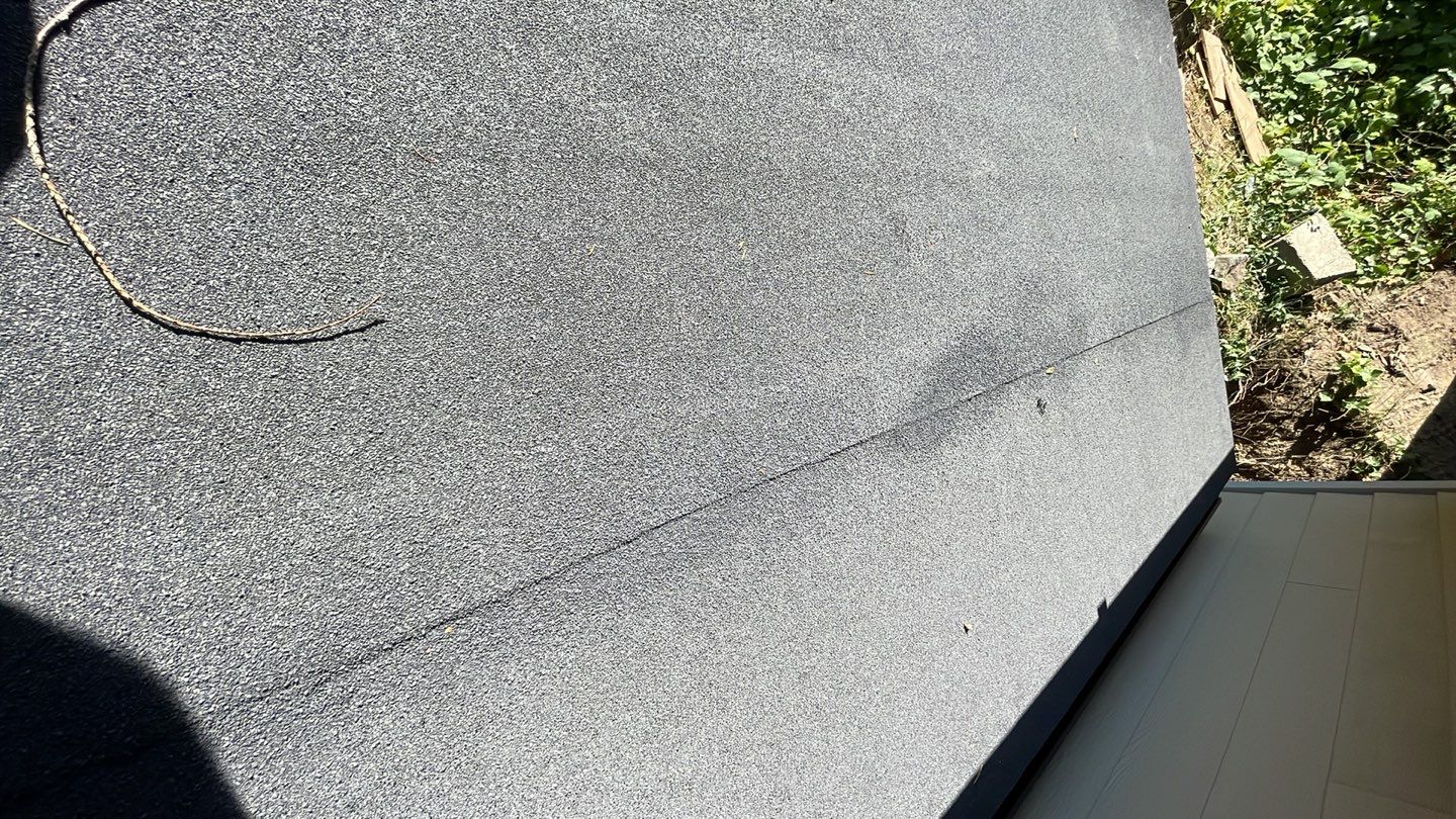 Small patio roof with 2ply sbs  by Top Notch Roofing Inc