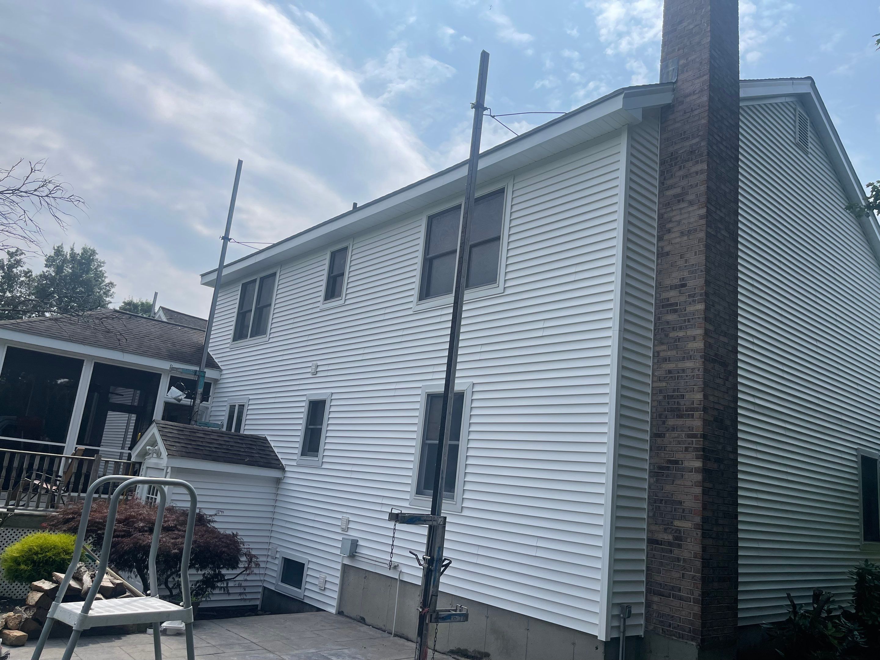 Siding Installation using Mainstreet Colonial & White gutters by A Plus Exterior
