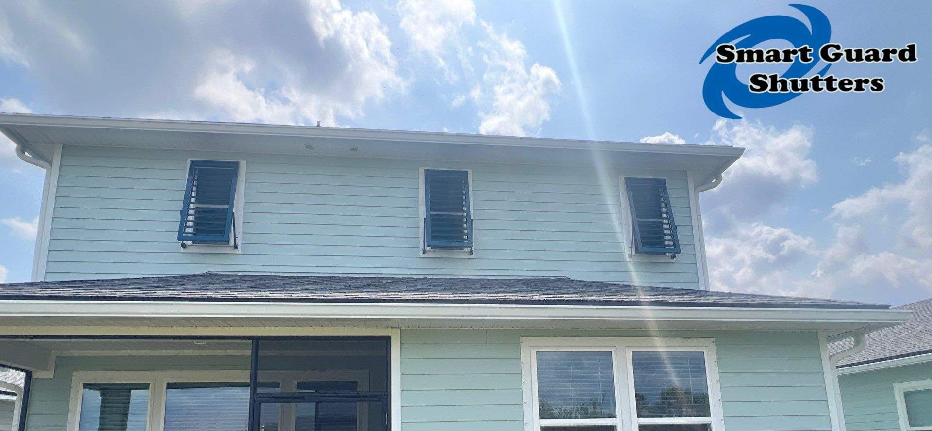 Impact Bahamas in Ocean Blue, Accordion in White by Smart Guard Shutters