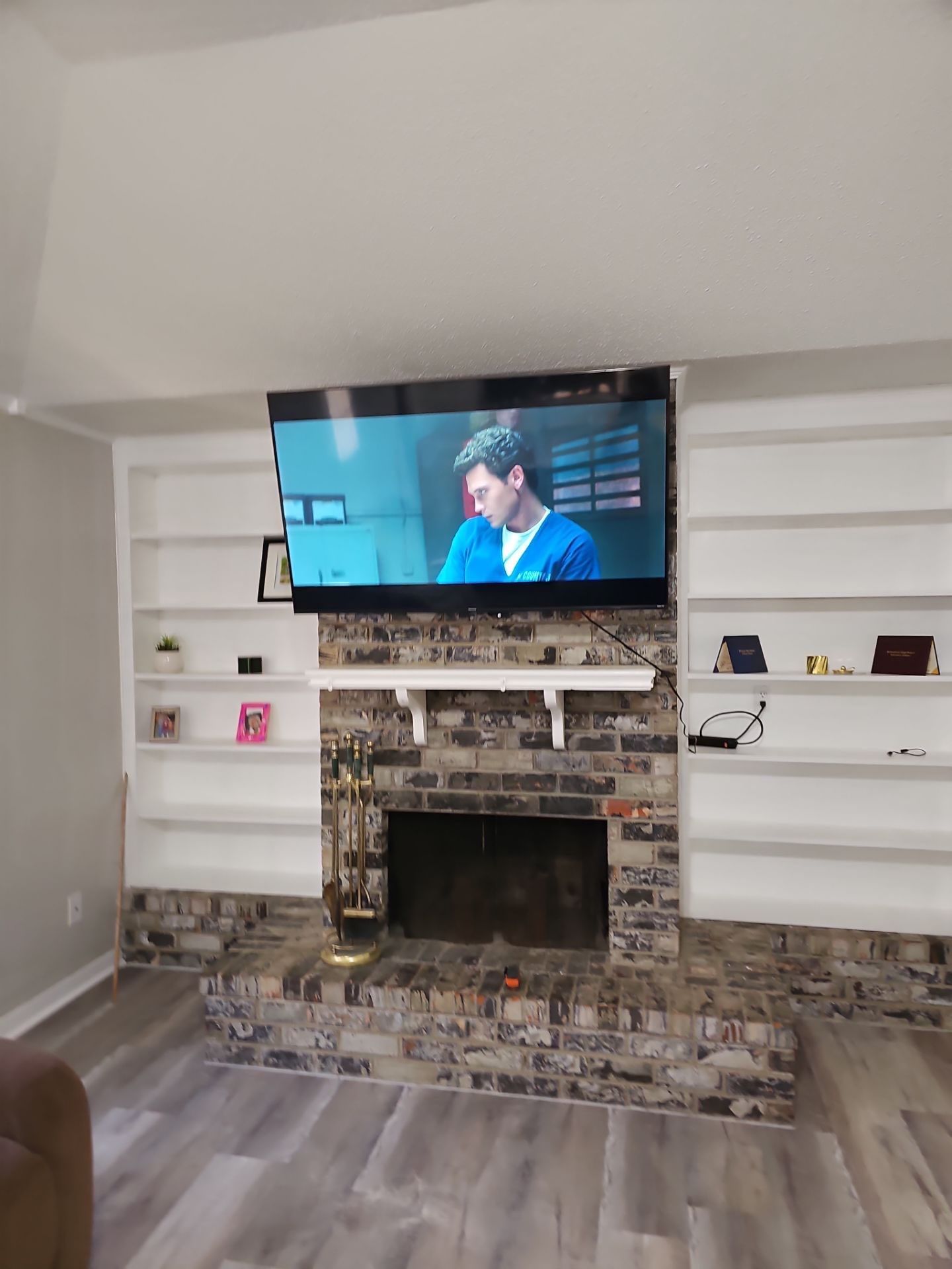 Floating Furniture, Fireplace Mantel, & Electric Fireplace Installation Projects by Hangman Mounting & Installation 
