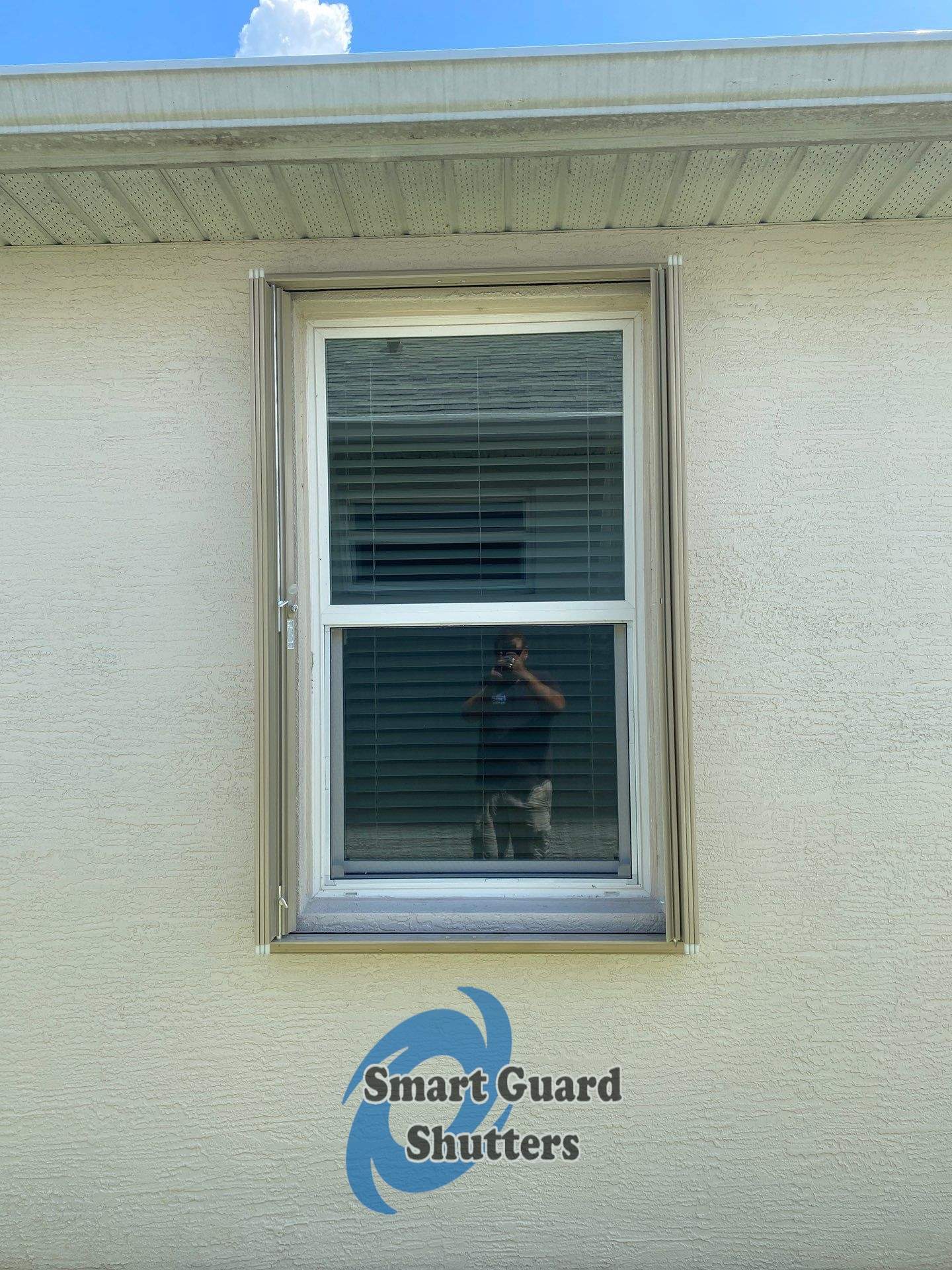 Accordion Shutters in Beige  by Smart Guard Shutters