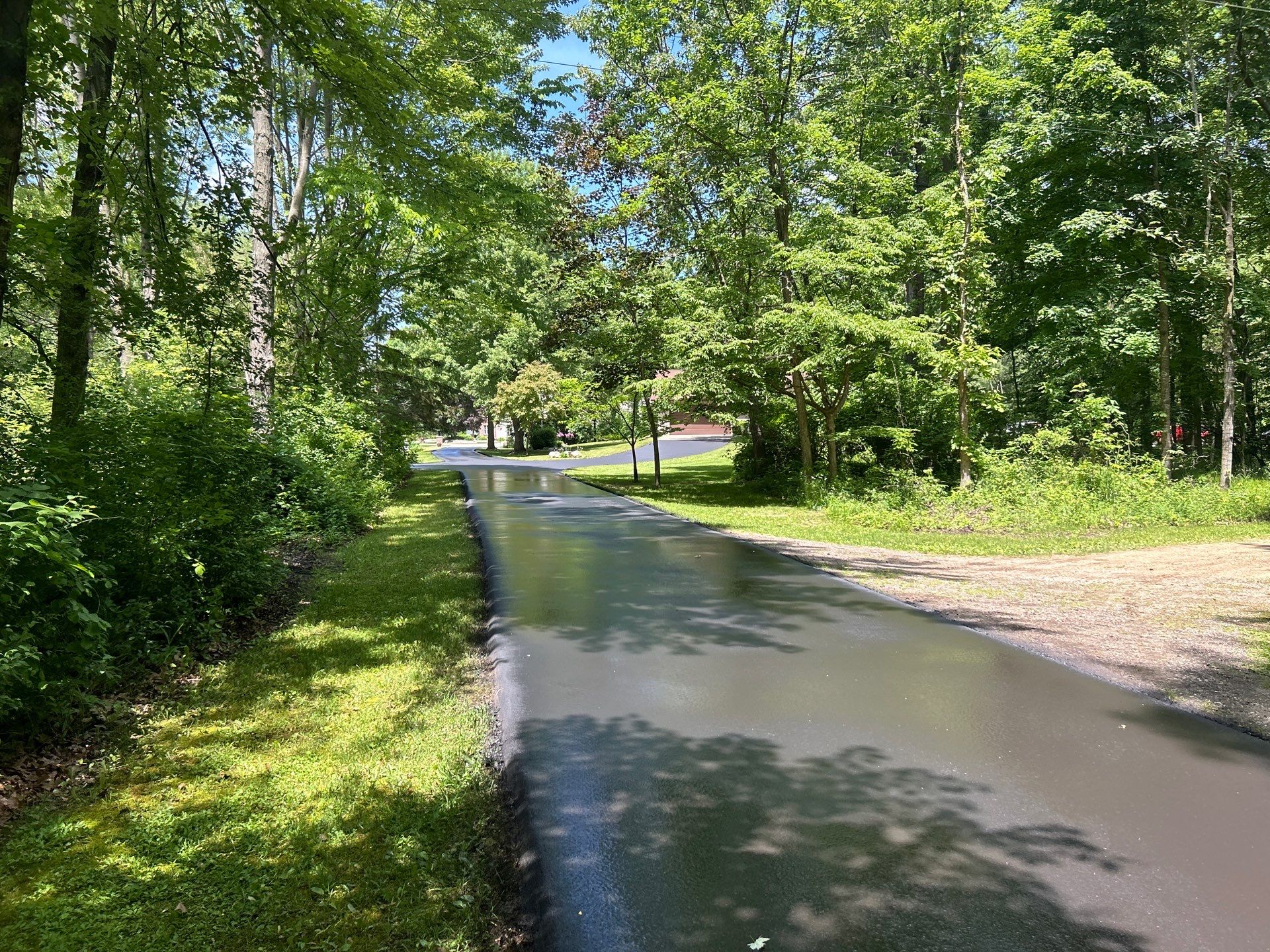 High end residential driveway by Quality Asphalt & Maintenance LLC