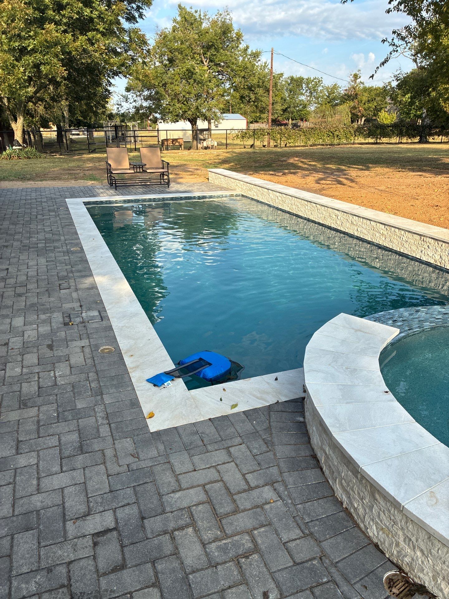 Geometric Pool with Raised Stone Spa by Pinnacle Pools and Spas - DFW