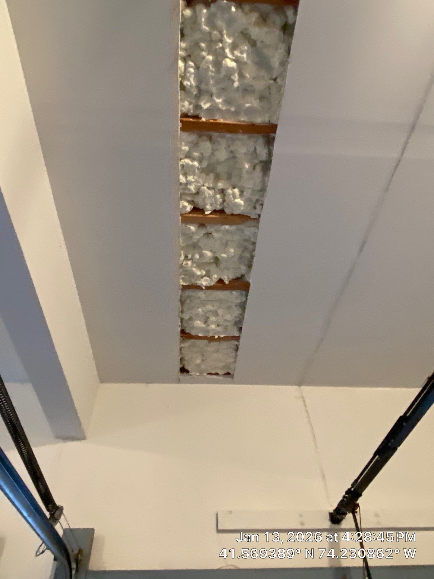 Garage ceiling using open cell spray foam by NYS Foam & Energy