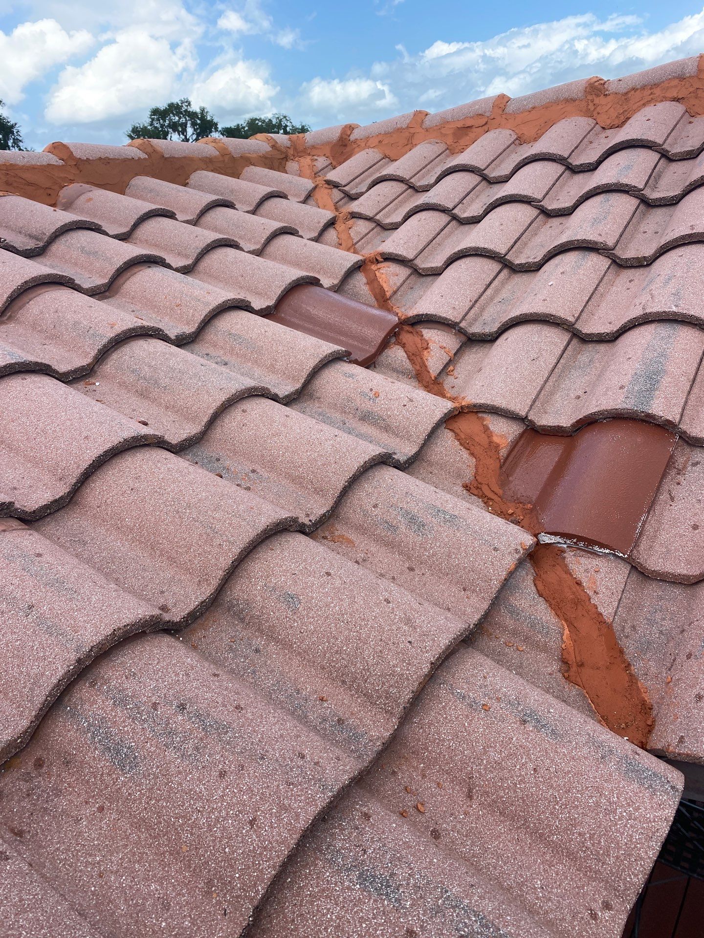 Concrete Tile Roof Repair and Ridge Cap Mortar Sealing in Orlando by Tip Top Roofing Co., Inc.