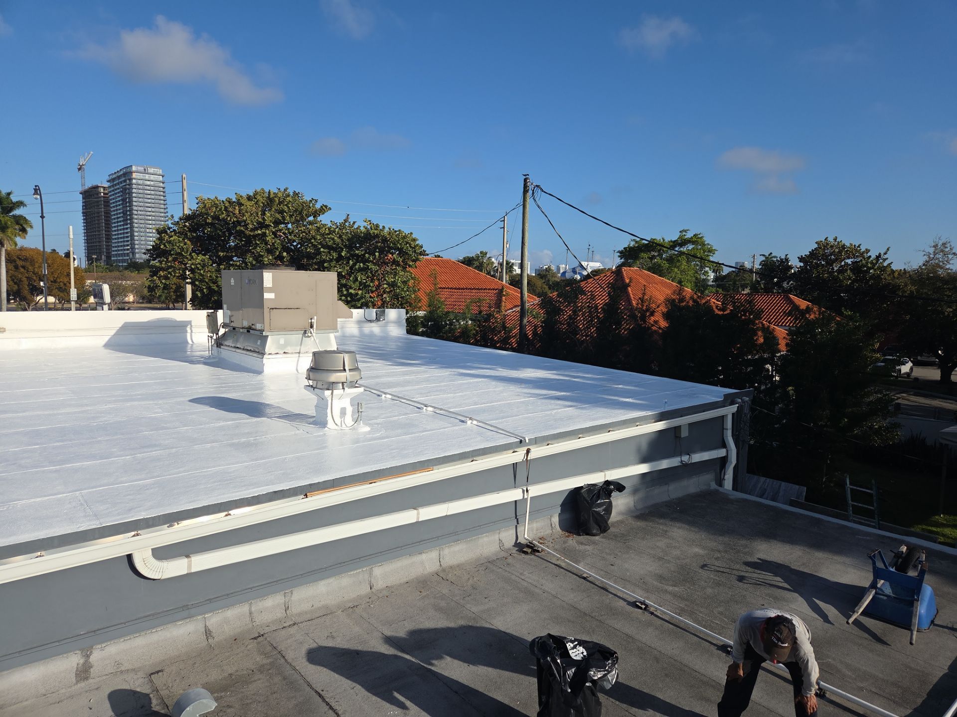 Commercial Flat Roof Restoration Using Silicone Coating in Hallandale Beach by Aastro Roofing