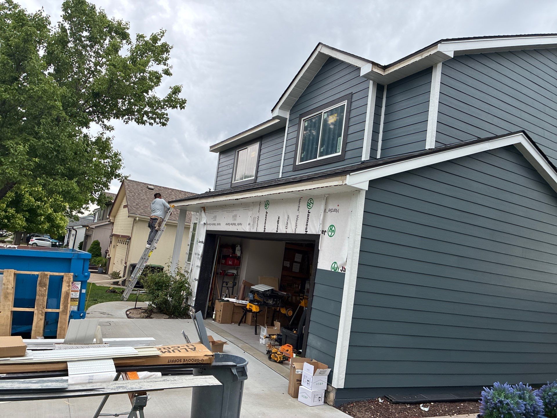 James Hardie Siding and Window Replacement with Arctic White Trim by Carps Complete Exteriors
