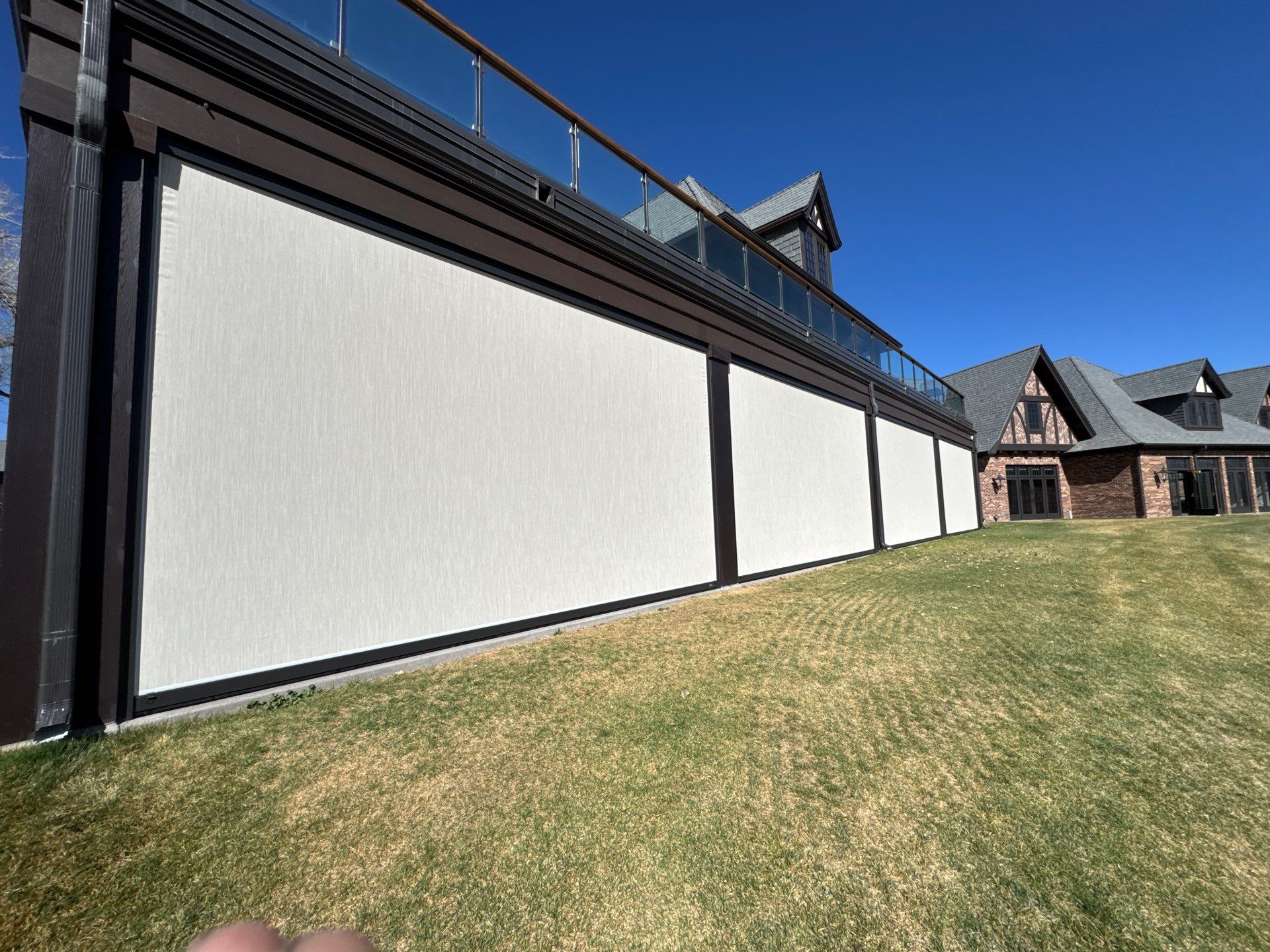 Motorized Screens using Progressive MagnaTrack Screens by Outdoor Solutions Colorado