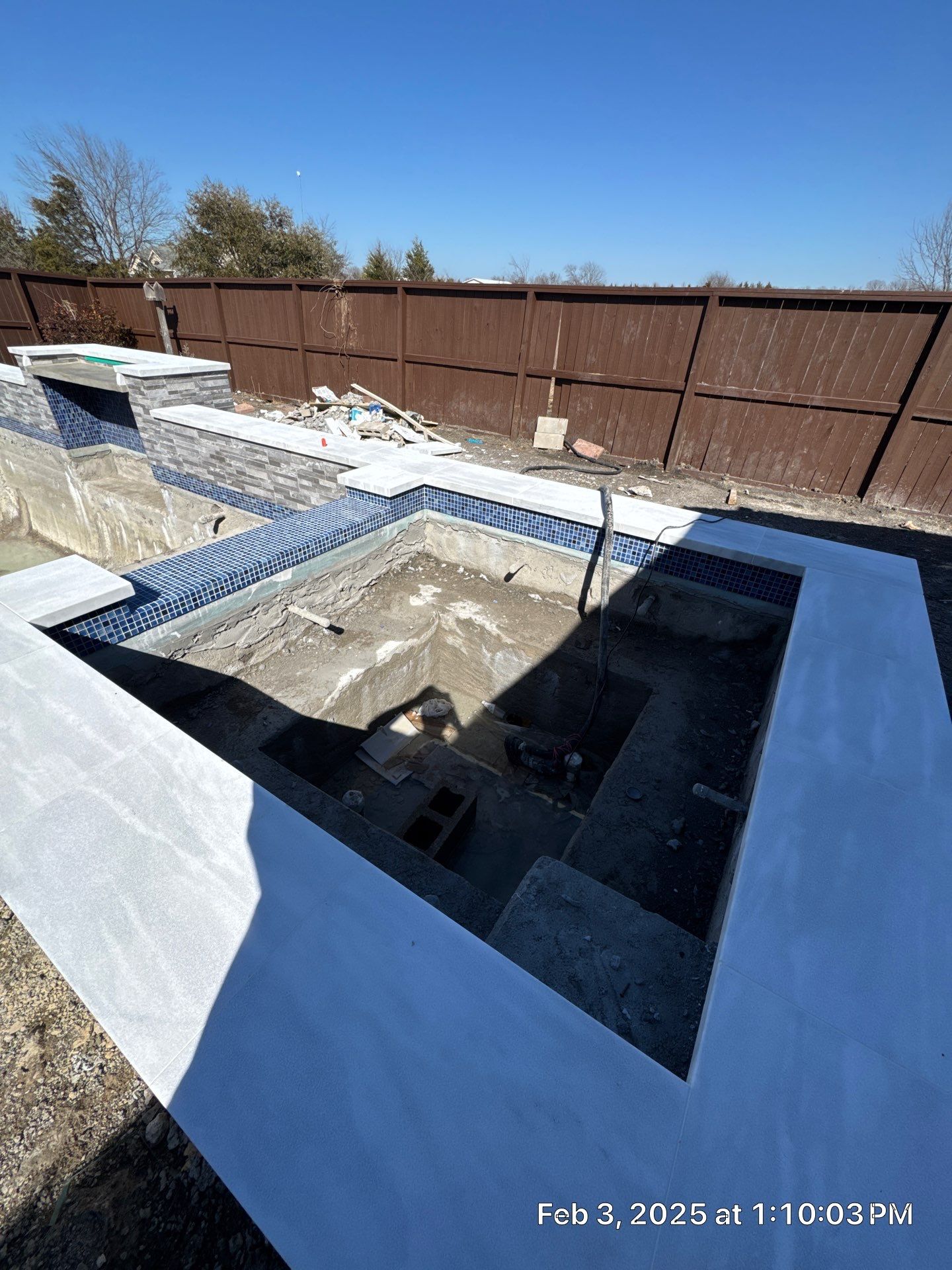 Geometric Pool and Spa with Stone Water Feature Wall by Pinnacle Pools and Spas - DFW