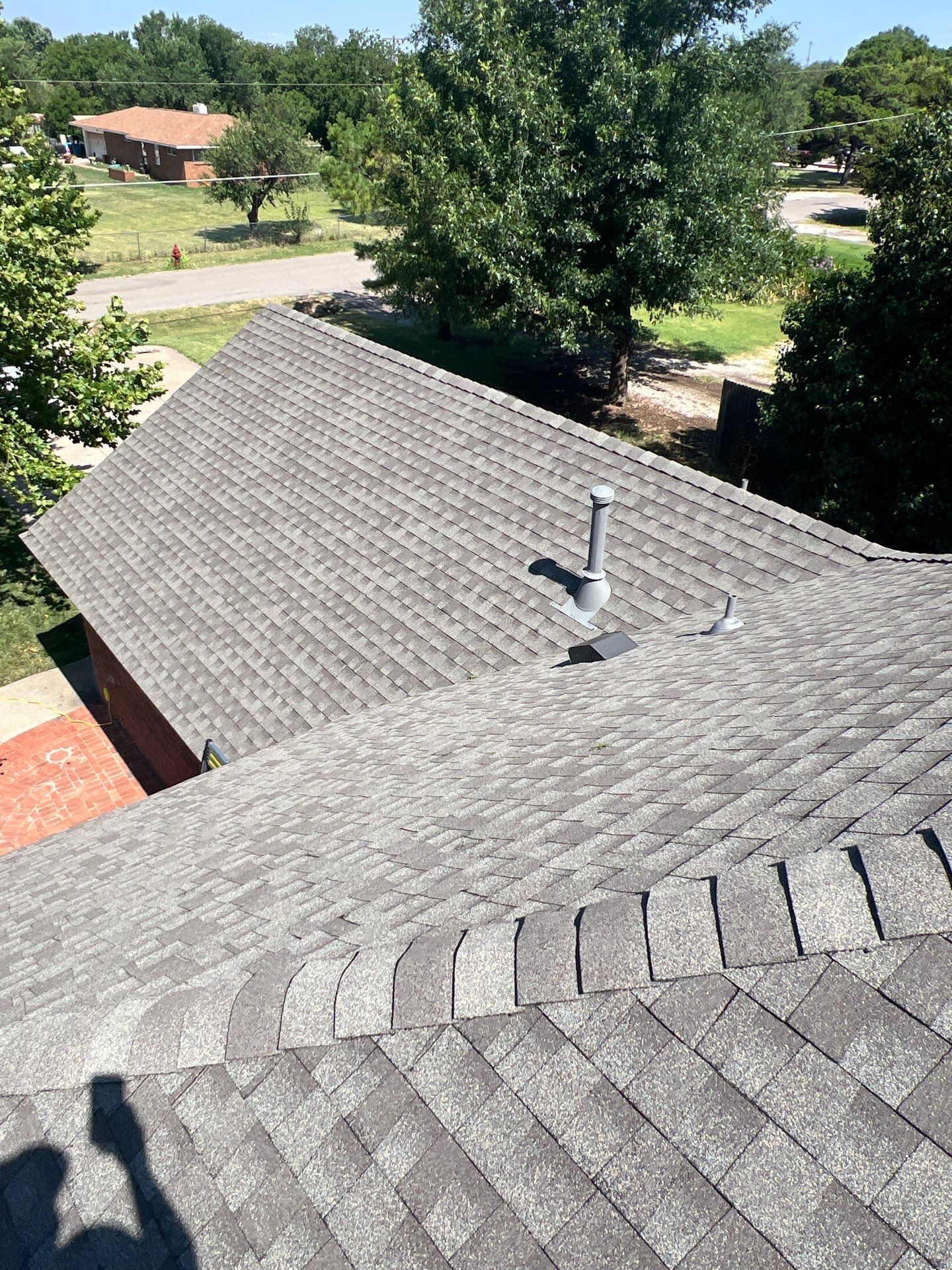 Roof Replacement and Gutter Installation in Edmond, OK by McCann's Roofing and Construction