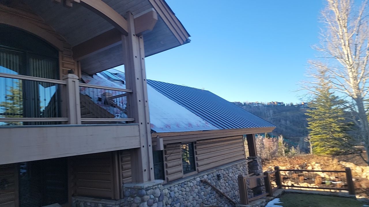 Standing Seam Metal Roof Replacement After Snow Damage by ASAP Roofing & Restoration