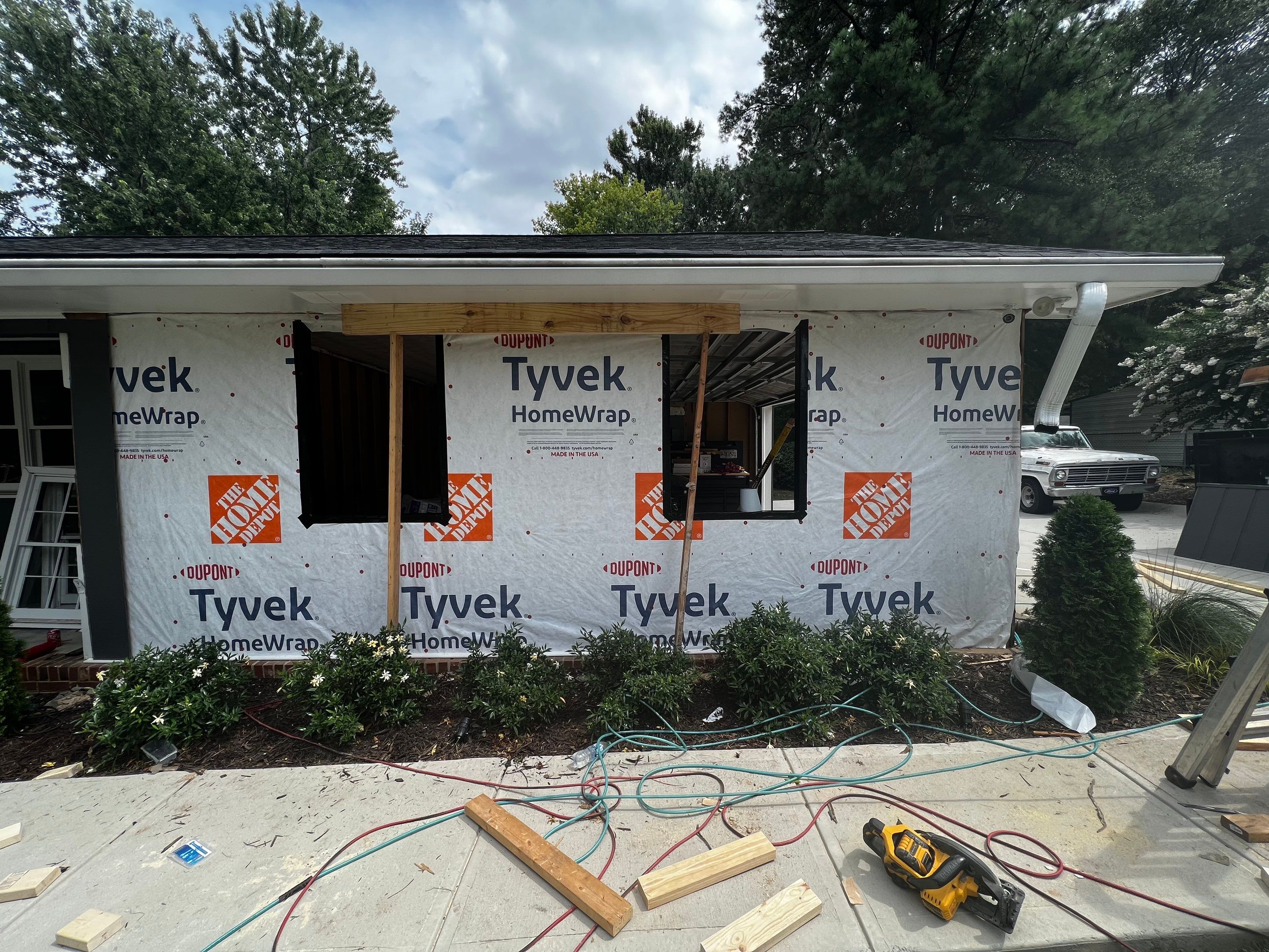 Snellville Garage Remodel Featuring Epoxy Floors and Board and Batten Siding by Swift Home Renovations