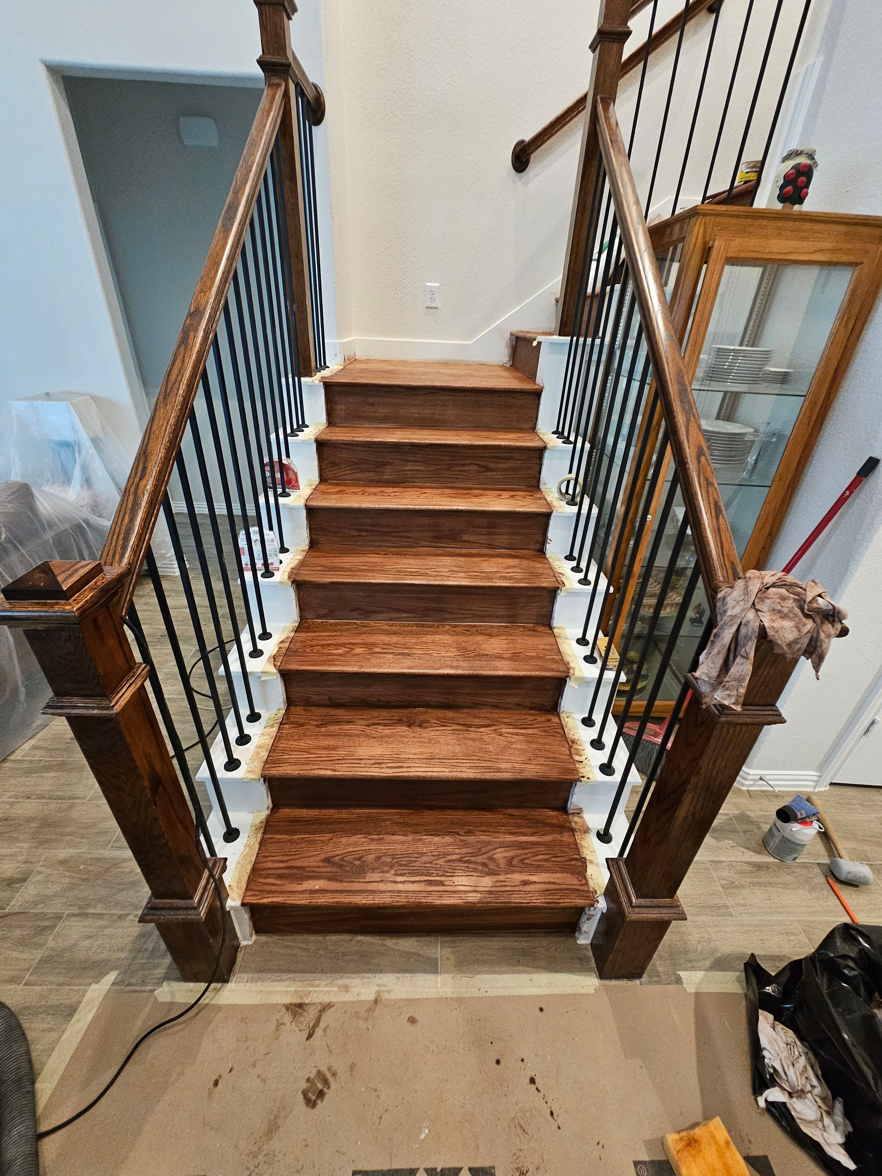 Carpet replacement with Tile and Red Oak Stairs by EL-GC LLC 