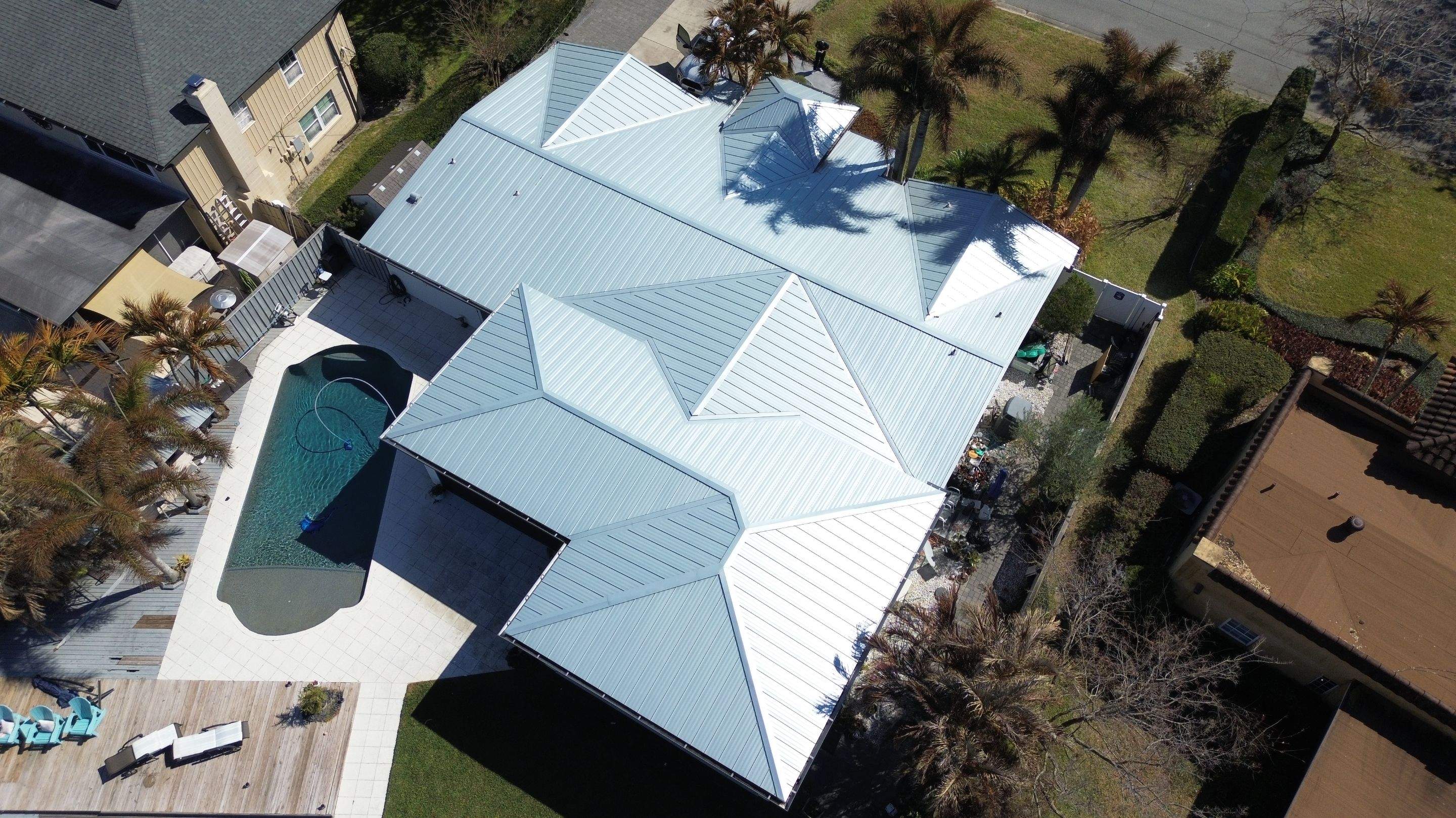 Metal reroof project in Belle Isle FL by Gold Key Roofing