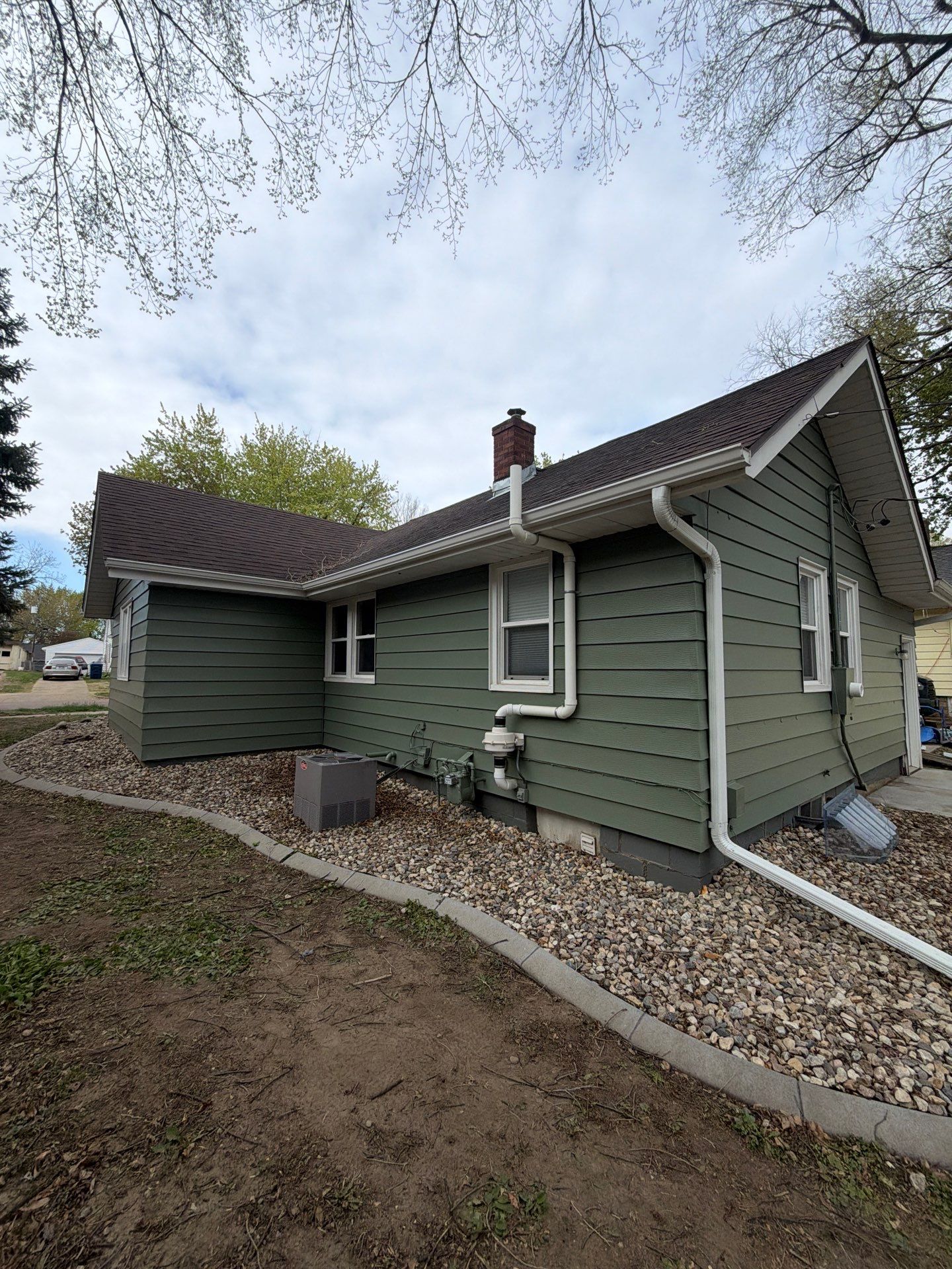 Exterior Siding Repair and Full House Repaint in Sioux Falls by Select Painting, Coatings & Garage Cabinets