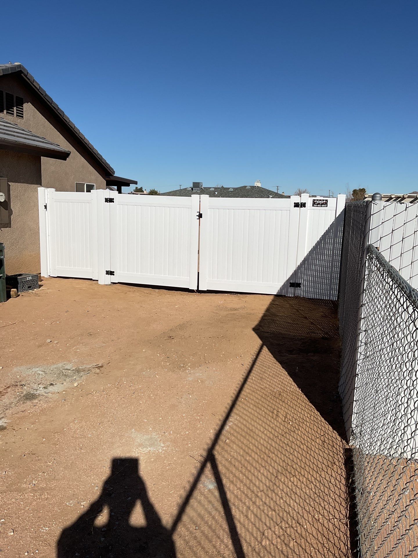 Gate installation using Vinyl by Fence Guys Inc. 