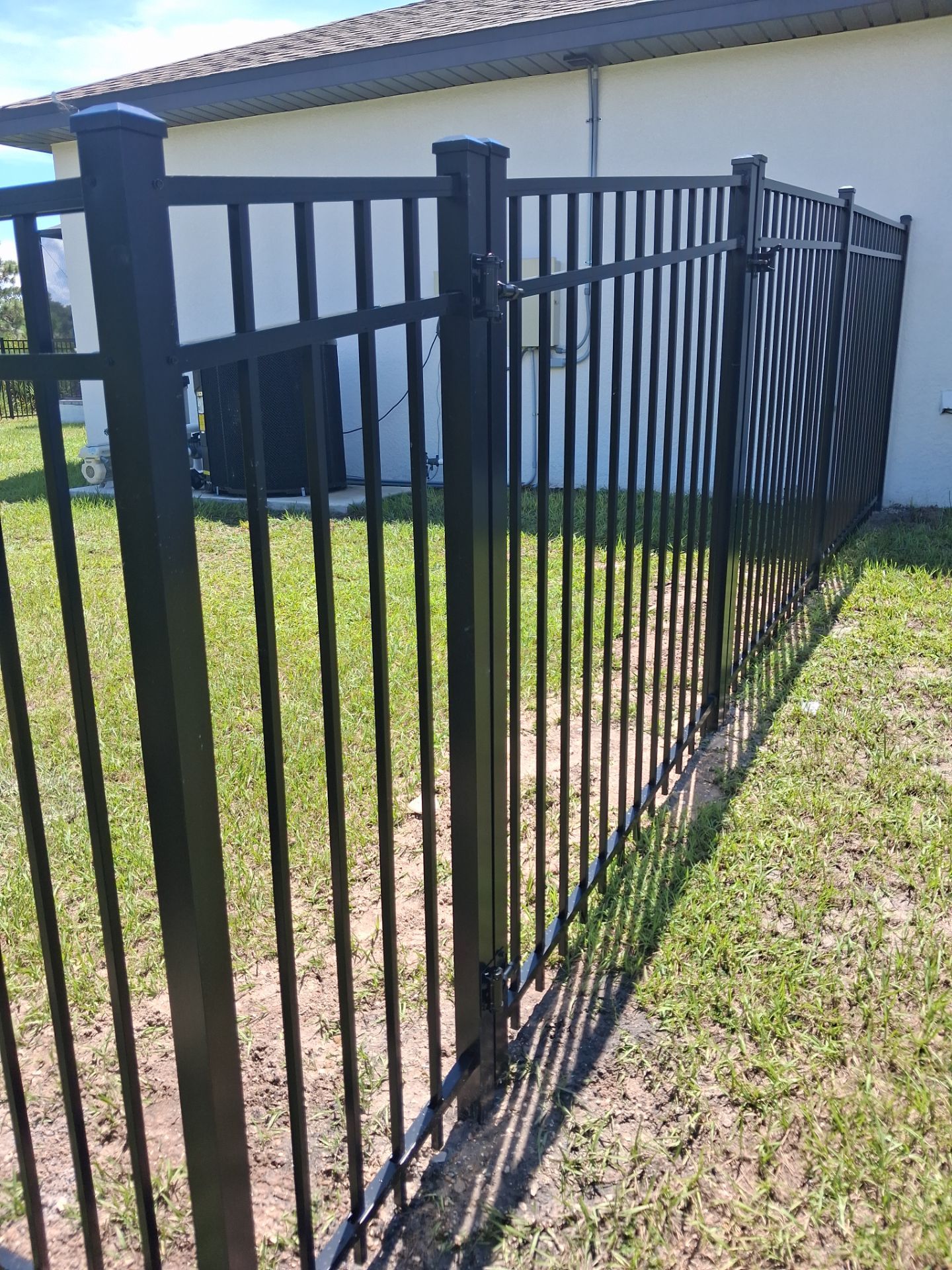 Black Aluminum Perimeter Fence and Gate Installation in Port Charlotte by True Fence LLC