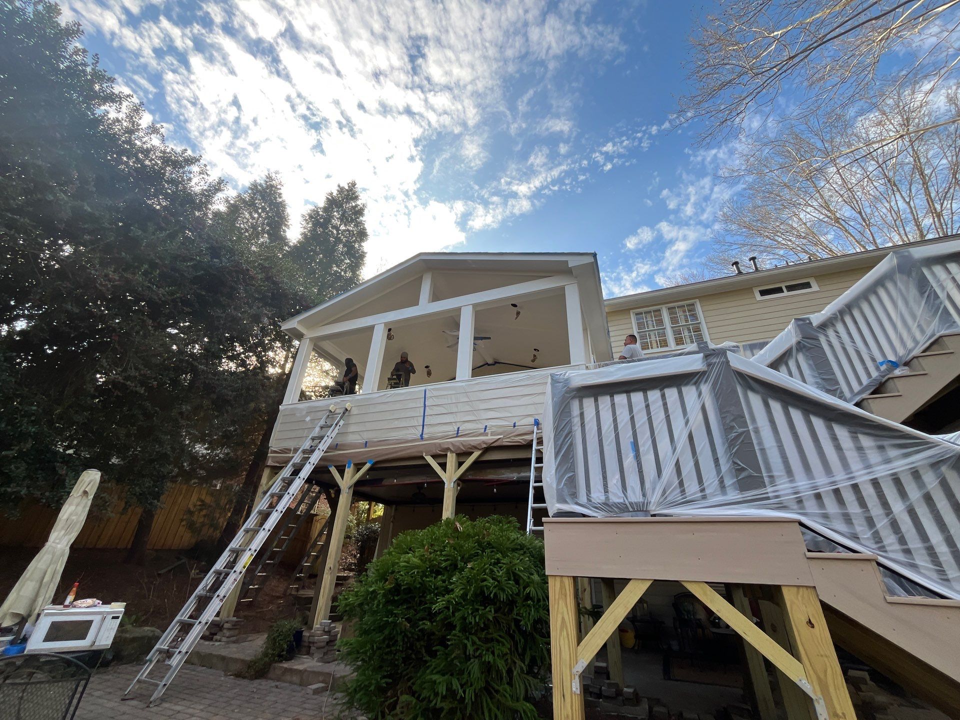 Deck Resurface and Screened-In Porch Build with Timbertech LED Lantern Post Cap Lights by Nelson Exteriors