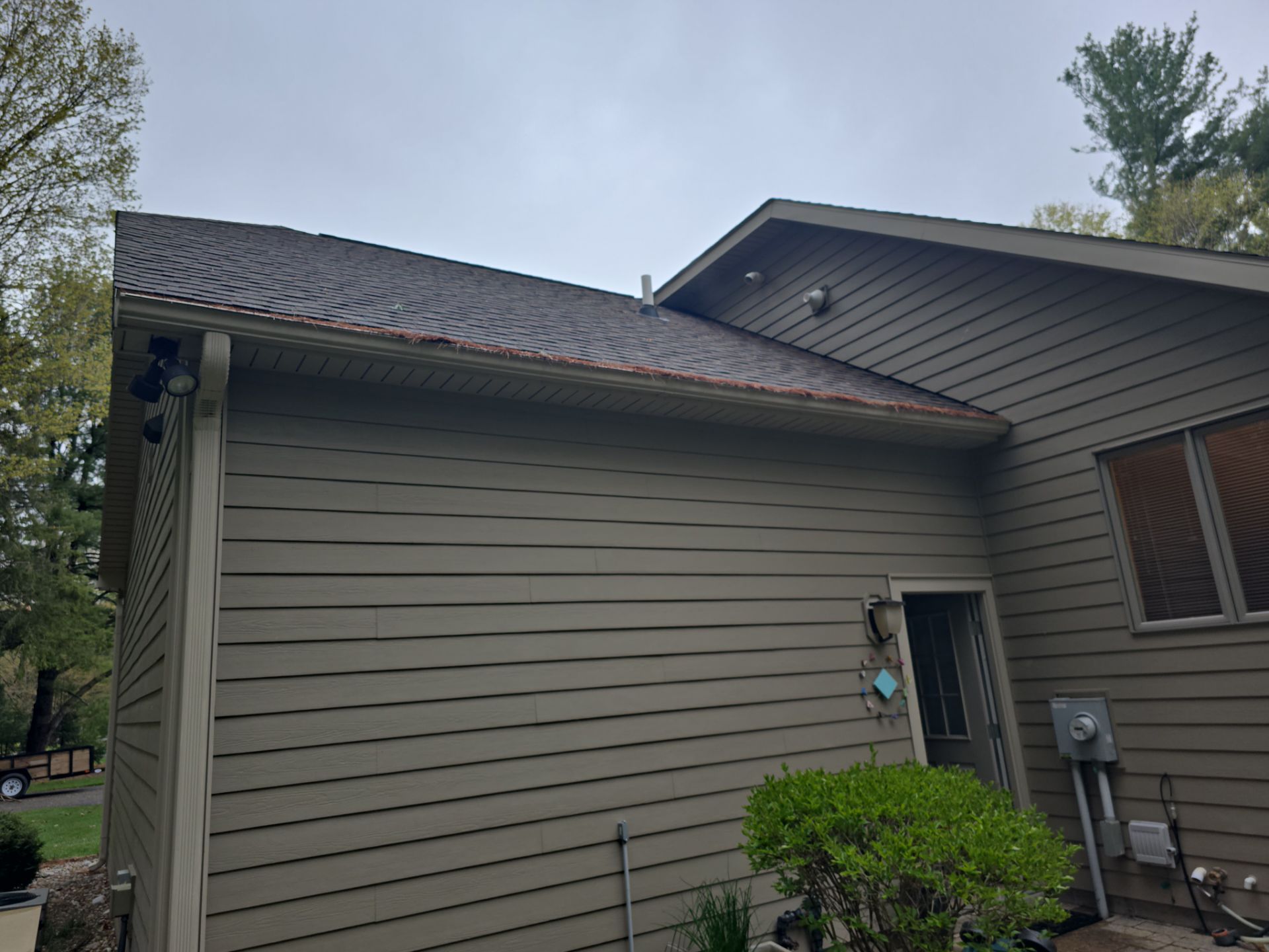Gutter Helmet Installation on a Multi-Level Traverse City Residence by Rainbow Seamless Systems