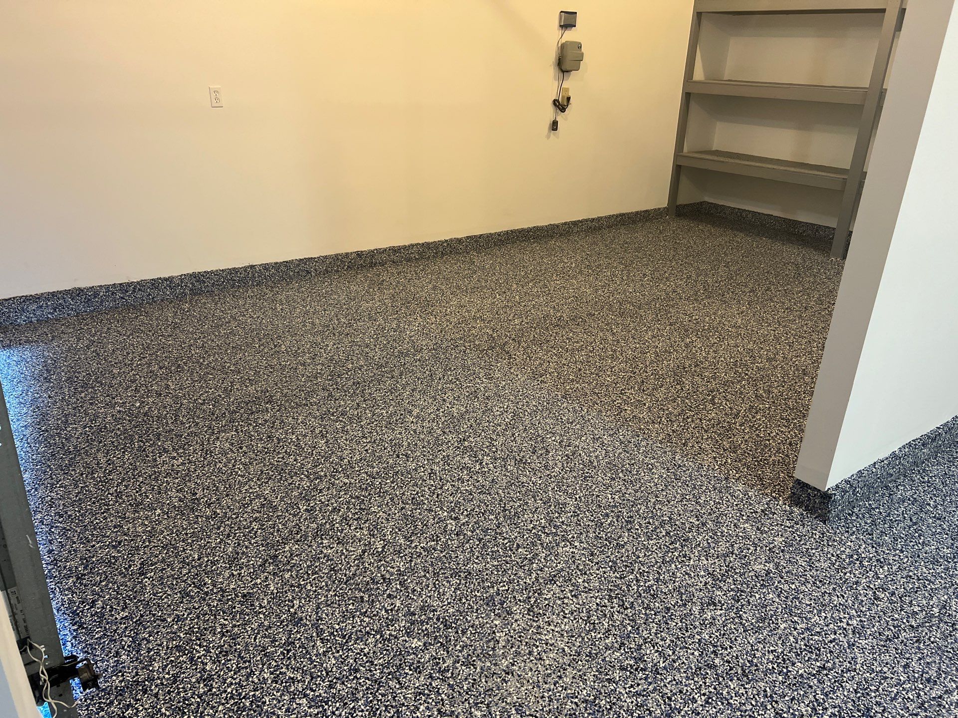 Custom Epoxy Flake Floor and Garage Wall Renovation in Ada by Gordon Painting