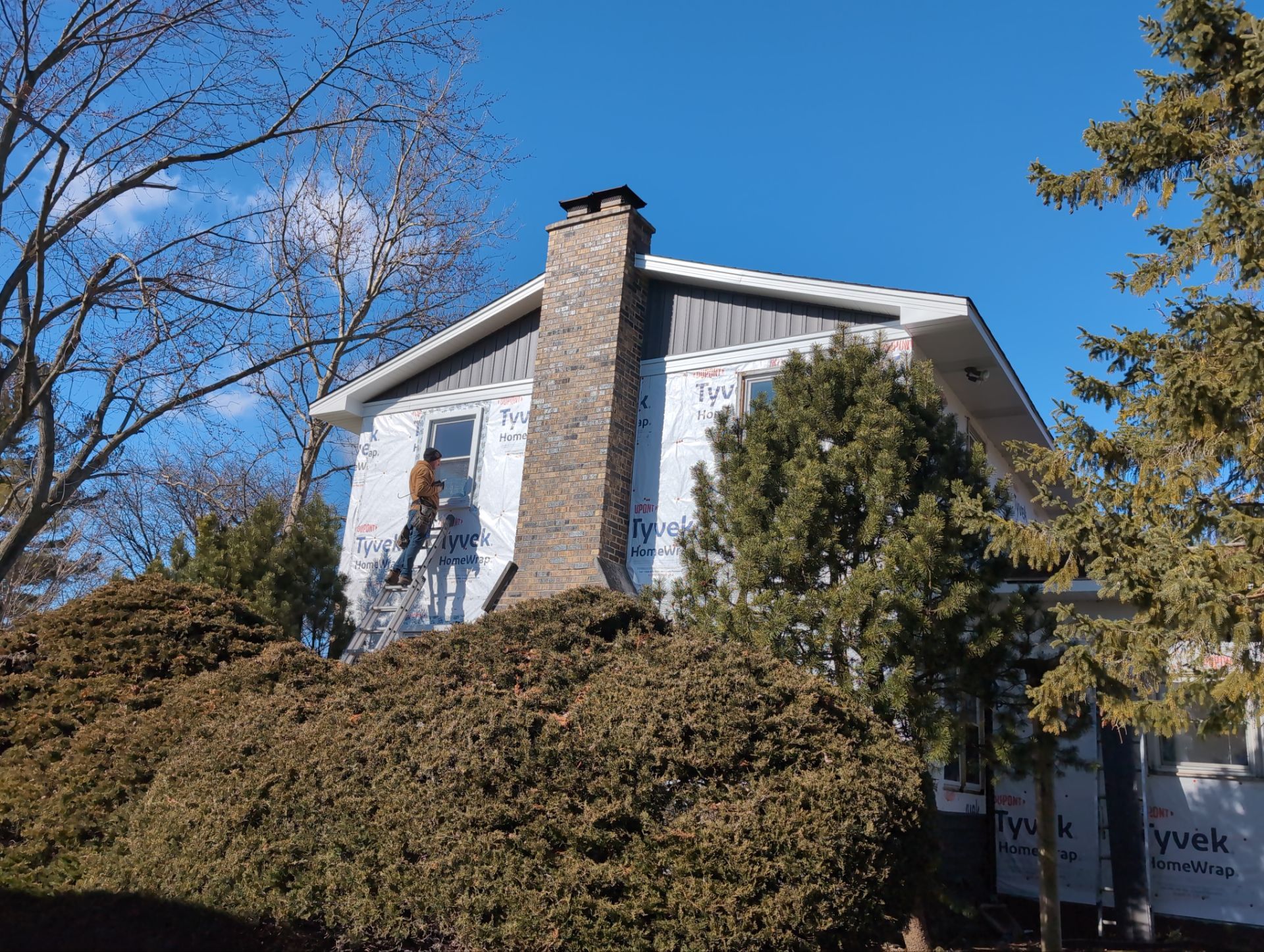 Vinyl siding replacement using CertainTeed Monogram double 5" vinyl siding  by AJ Exteriors & Roofing Inc.