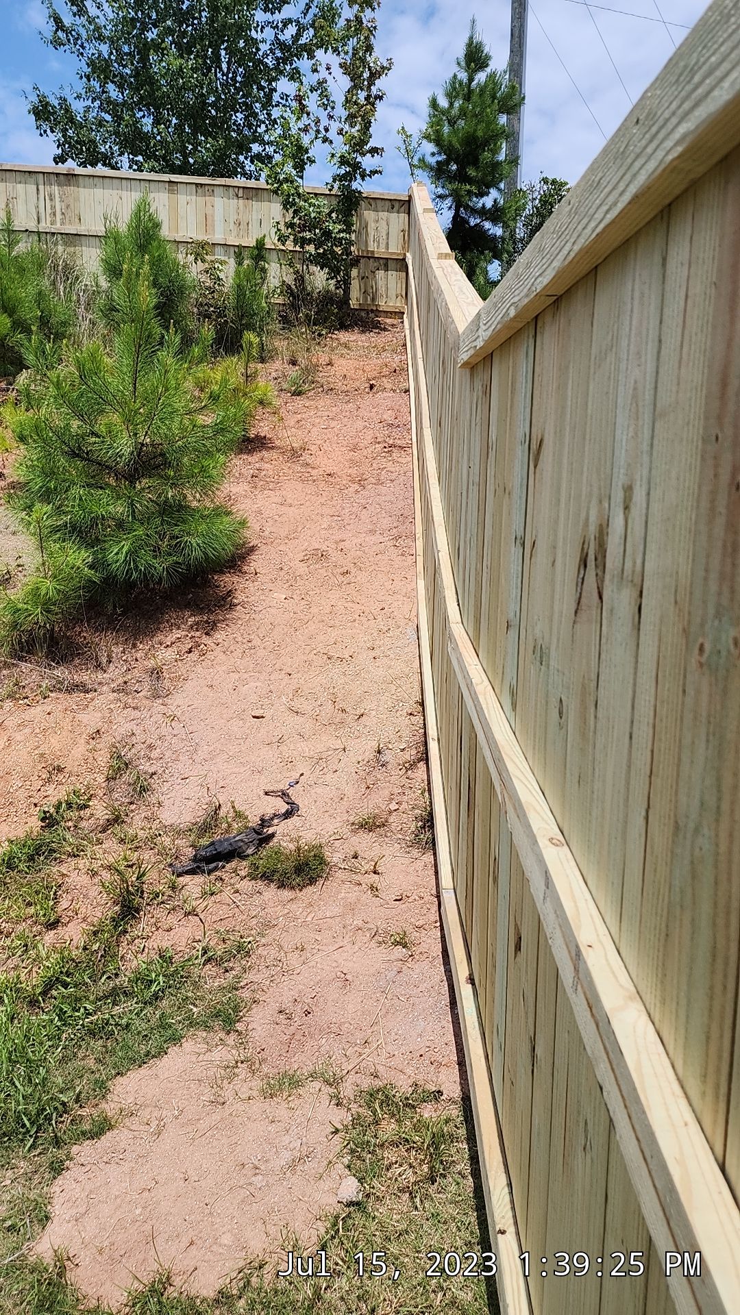 Fence Installation of Capped Wood Privacy by Titans of Timber Fence & Stain