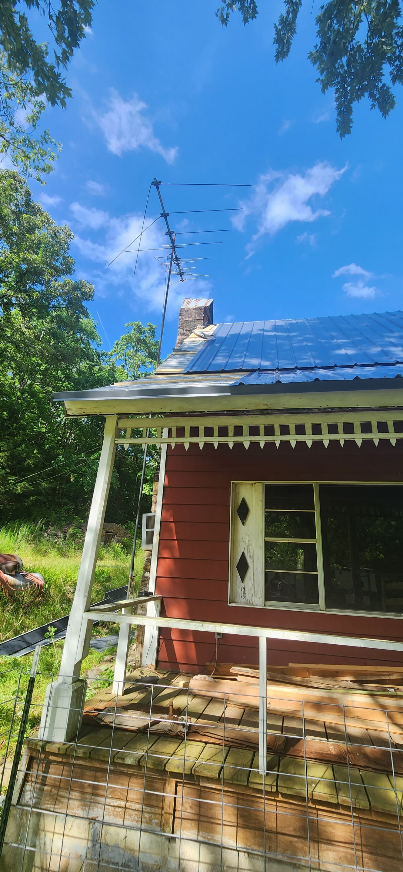 Residential Roofing Installation using 26 Gauge Colored Panels by Hostetler Roofing